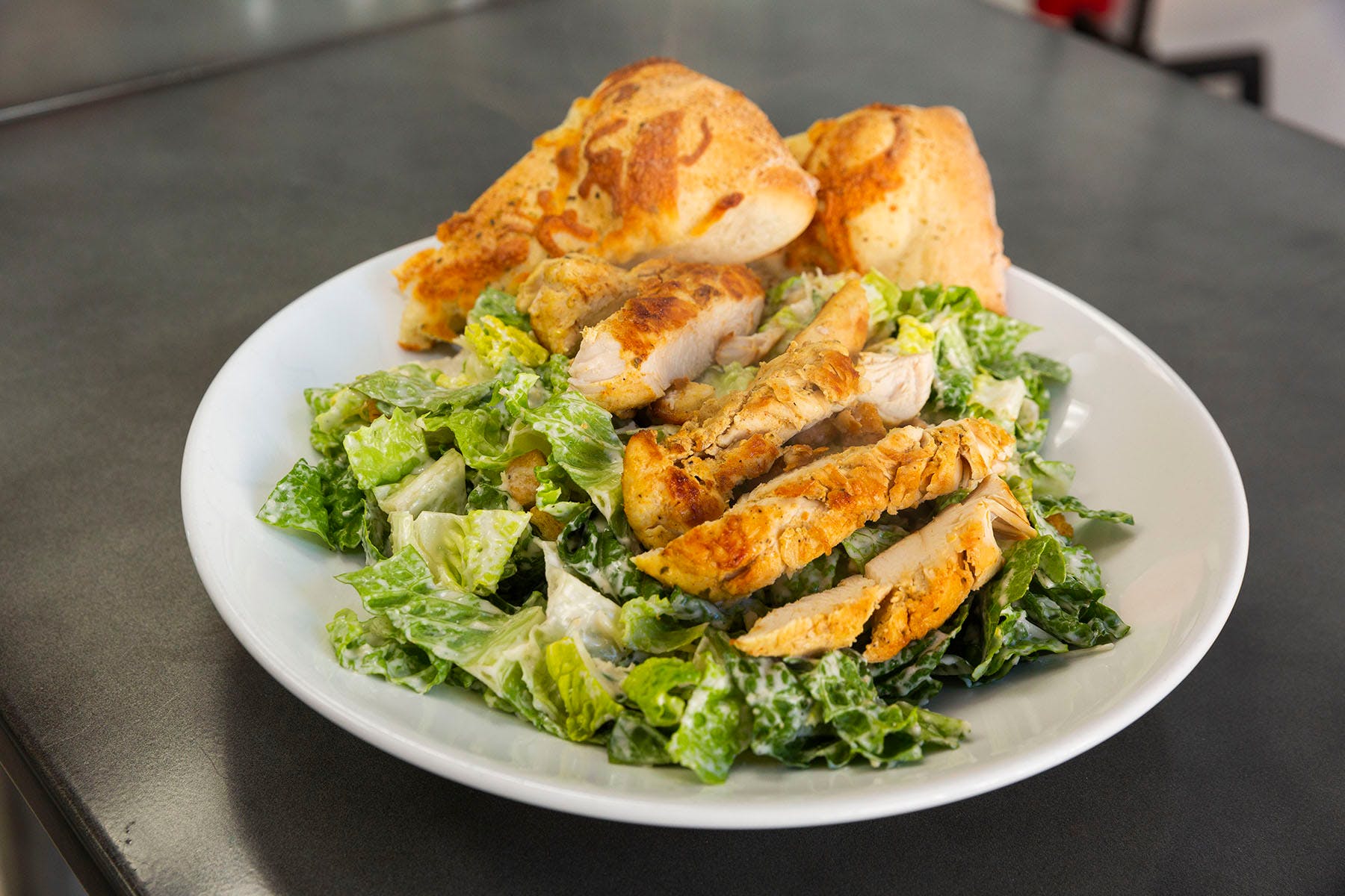 Order Chicken Caesar Salad - Salads food online from College Pizza store, Boston on bringmethat.com
