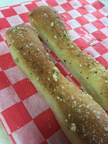 Order Three Homemade Breadsticks - Appetizer food online from Firepit Pizzeria & Grill store, Springfield on bringmethat.com