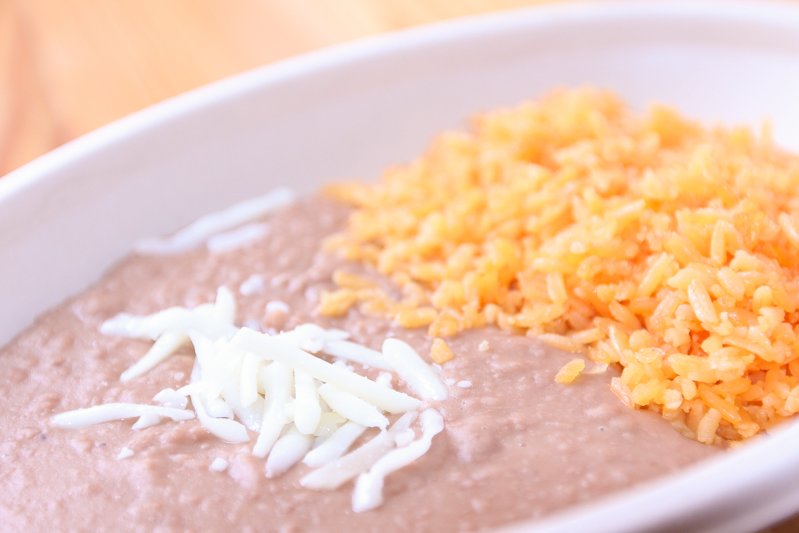 Order Refried Beans and Rice food online from Dos Hermanos store, Columbus on bringmethat.com