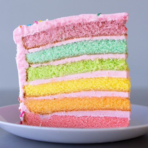 Order Rainbow Strawberry Cake Slice food online from Carlo's Bakery store, Bloomington on bringmethat.com