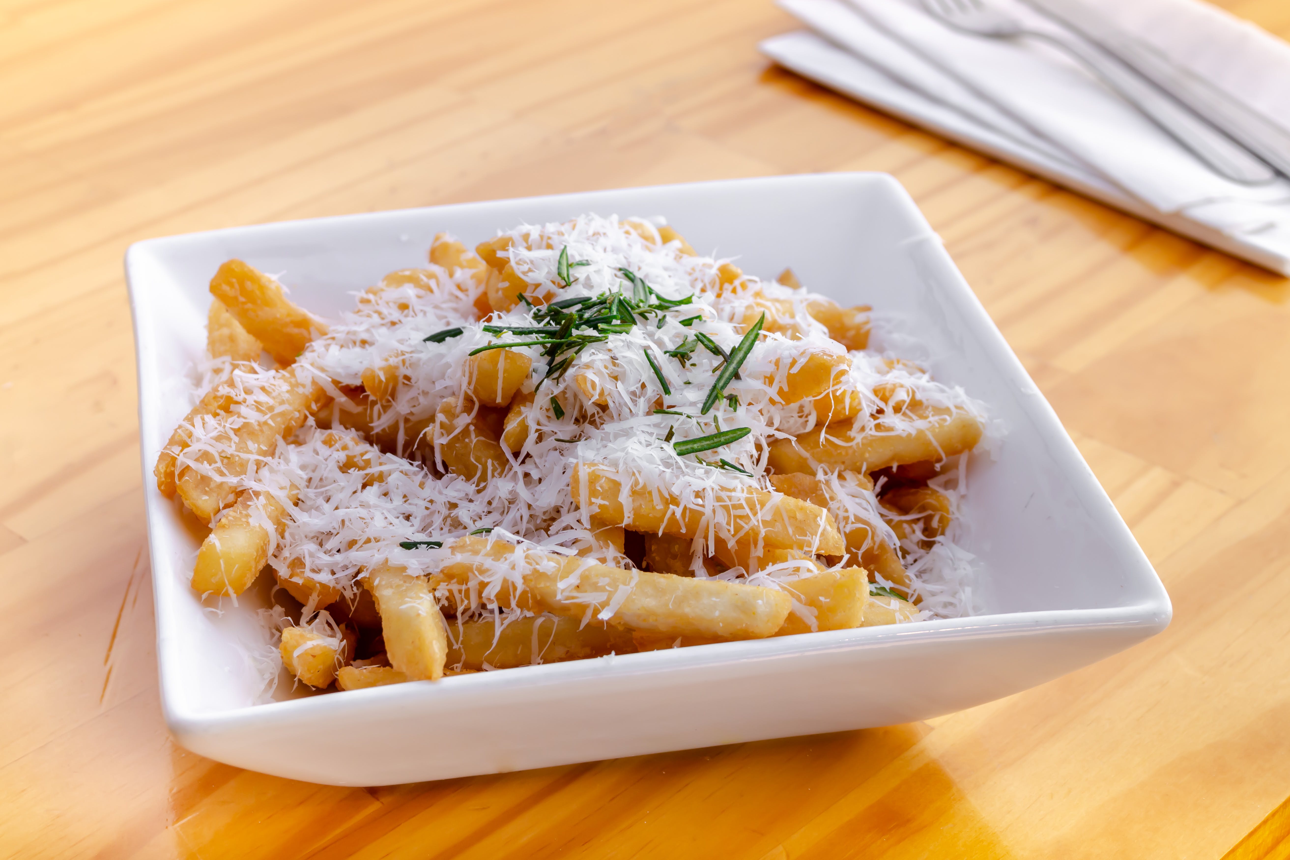 Order Truffle Fries - Side food online from Urban Tomato store, Palisades Park on bringmethat.com