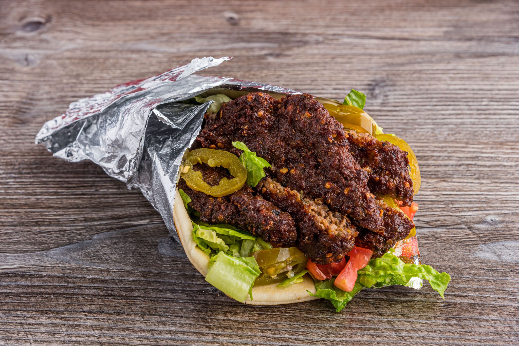 Order Chapli Kabab Sandwich food online from Gyro hut store, Houston on bringmethat.com