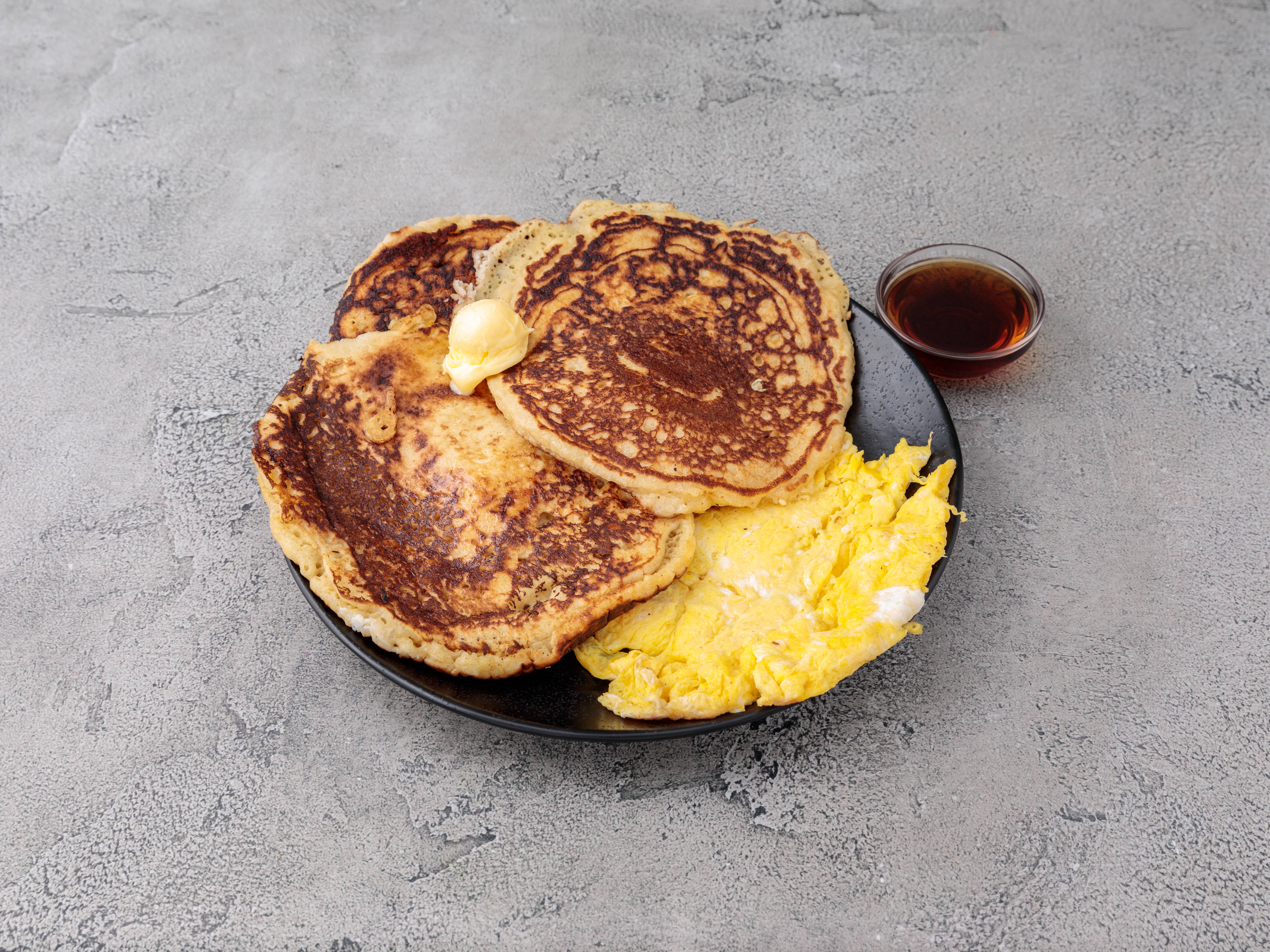 Order Golden Brown Pancake with 2 Eggs Any Style food online from 57 Pancake House store, New York on bringmethat.com