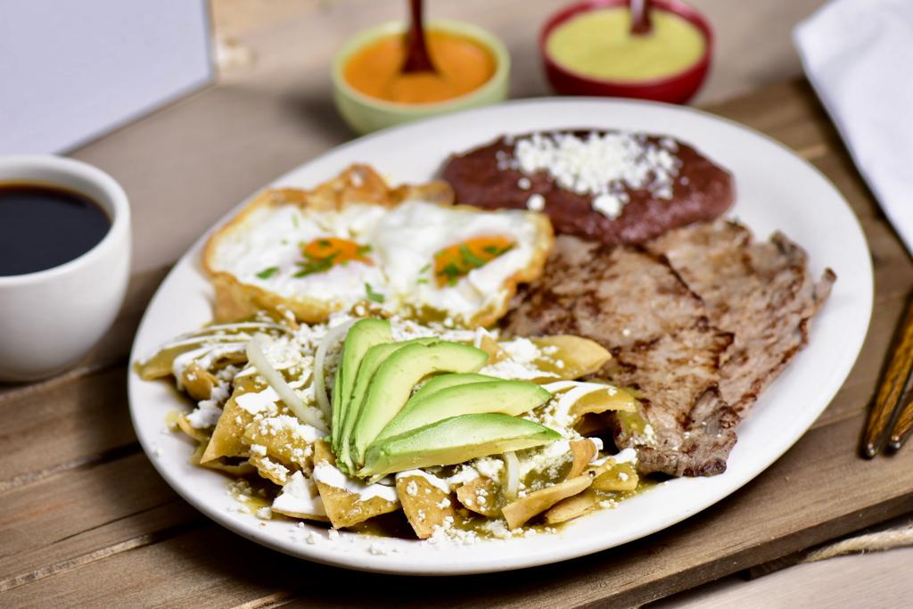 Order Chilaquiles Verdes con Carne Asada / Green Chilaquiles  with Marinated Thin Steak  food online from La Hacienda Restaurant store, Perth Amboy on bringmethat.com