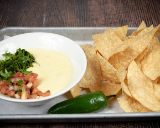 Order Chips & Queso food online from Lickity Chicken store, San Marcos on bringmethat.com