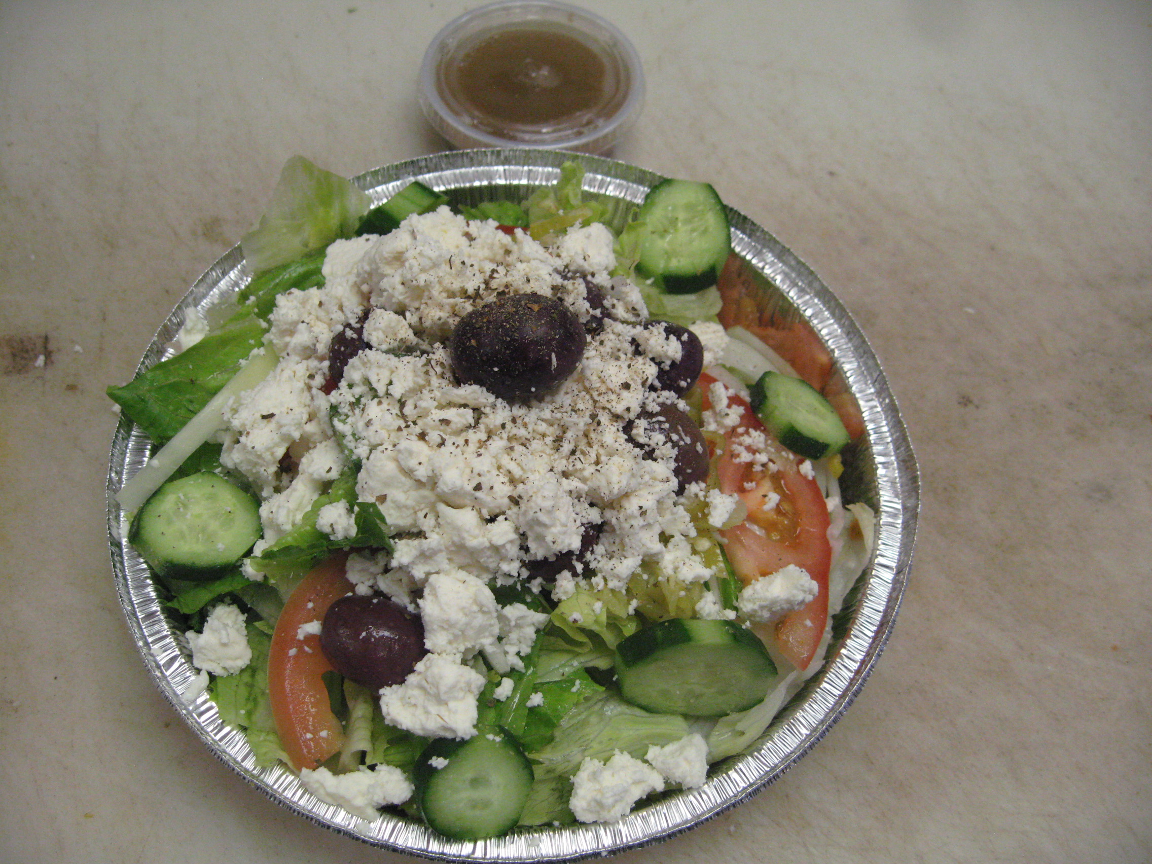 Order Greek Salad food online from Papas Pizza store, San Diego on bringmethat.com