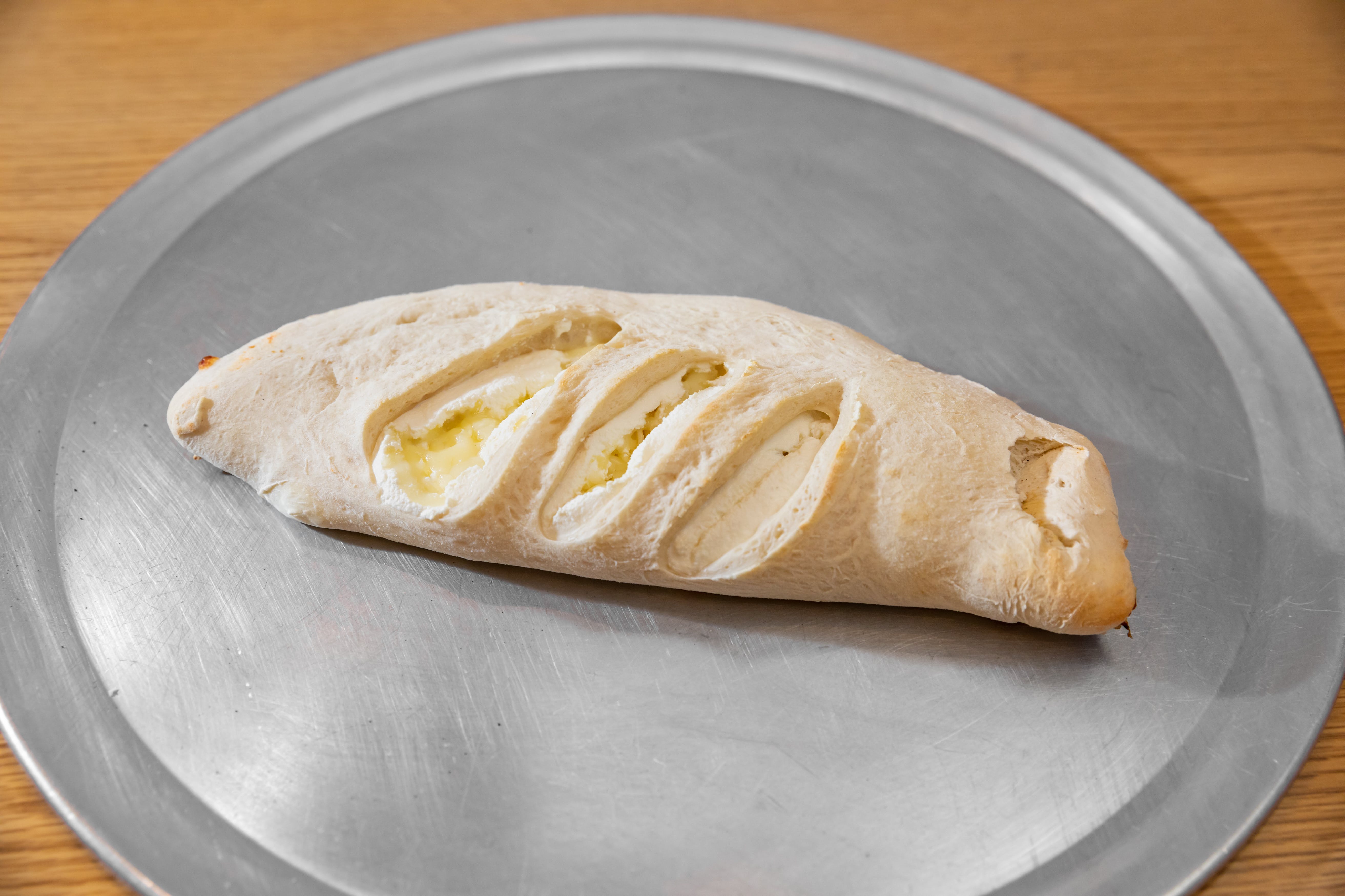Order Cheese Calzone - Roll food online from Milano Pizza store, Collierville on bringmethat.com
