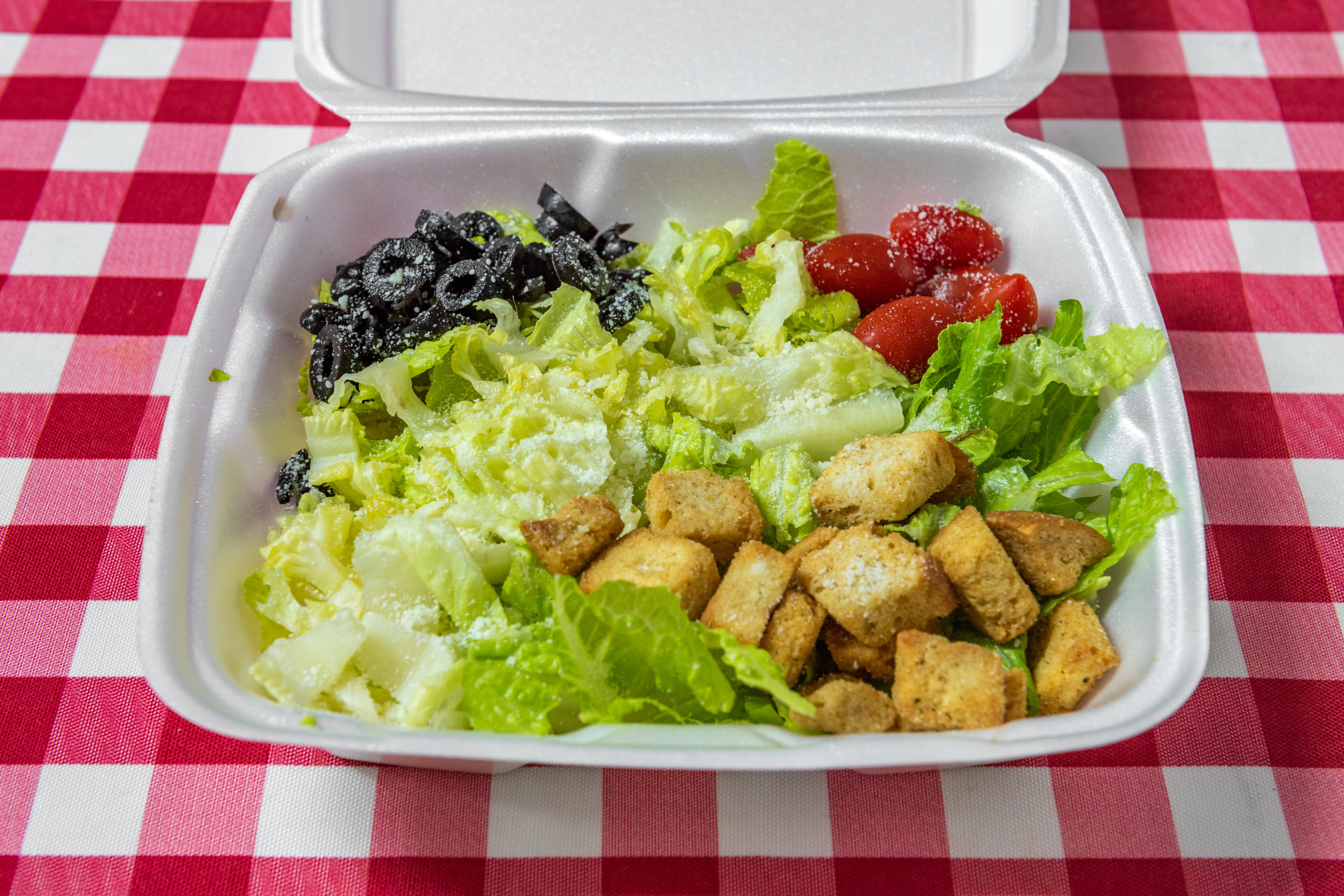 Order Caesar Salad - Salad food online from Sunny's Pizza store, San Marcos on bringmethat.com