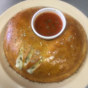 Order Deluxe Calzone food online from Massino Pizzeria store, Denver on bringmethat.com