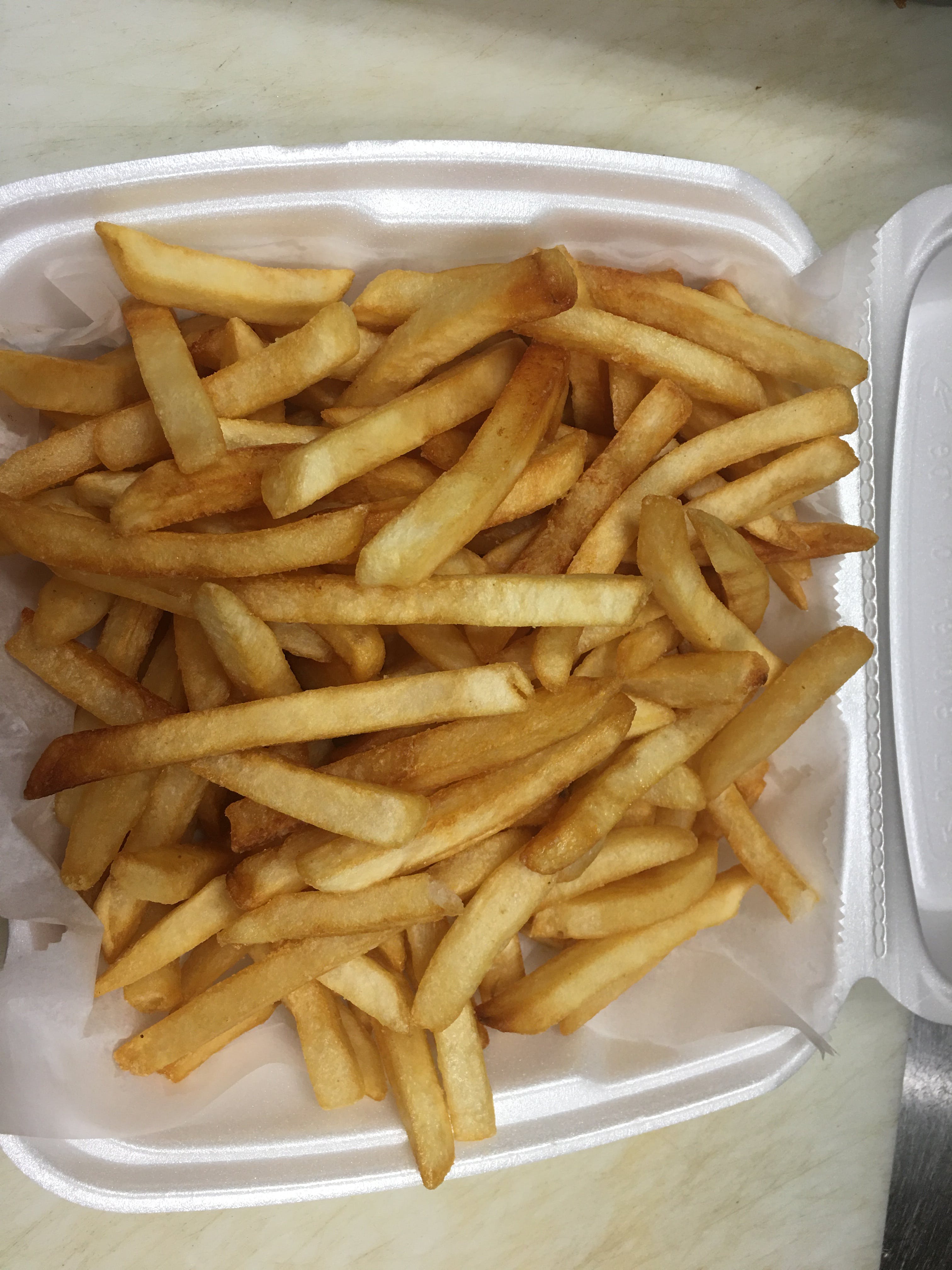 Order French Fries - Side food online from New Tiny's Grill store, Media on bringmethat.com