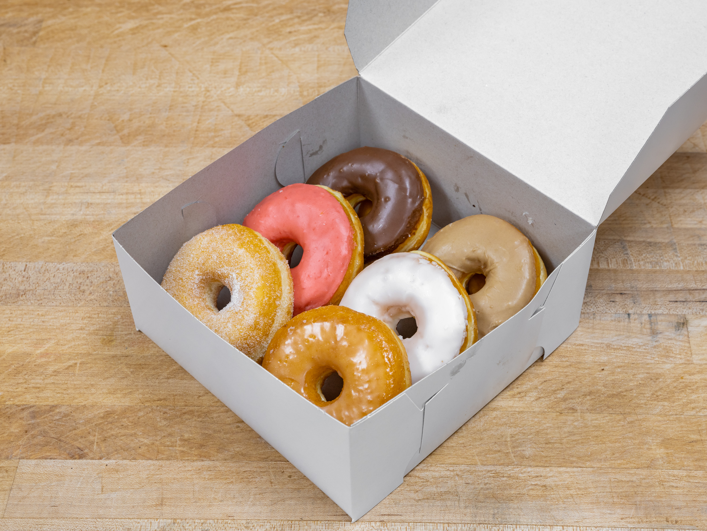 Order 1/2 Dozen House Mixed food online from K-Inn Donuts store, Paramount on bringmethat.com