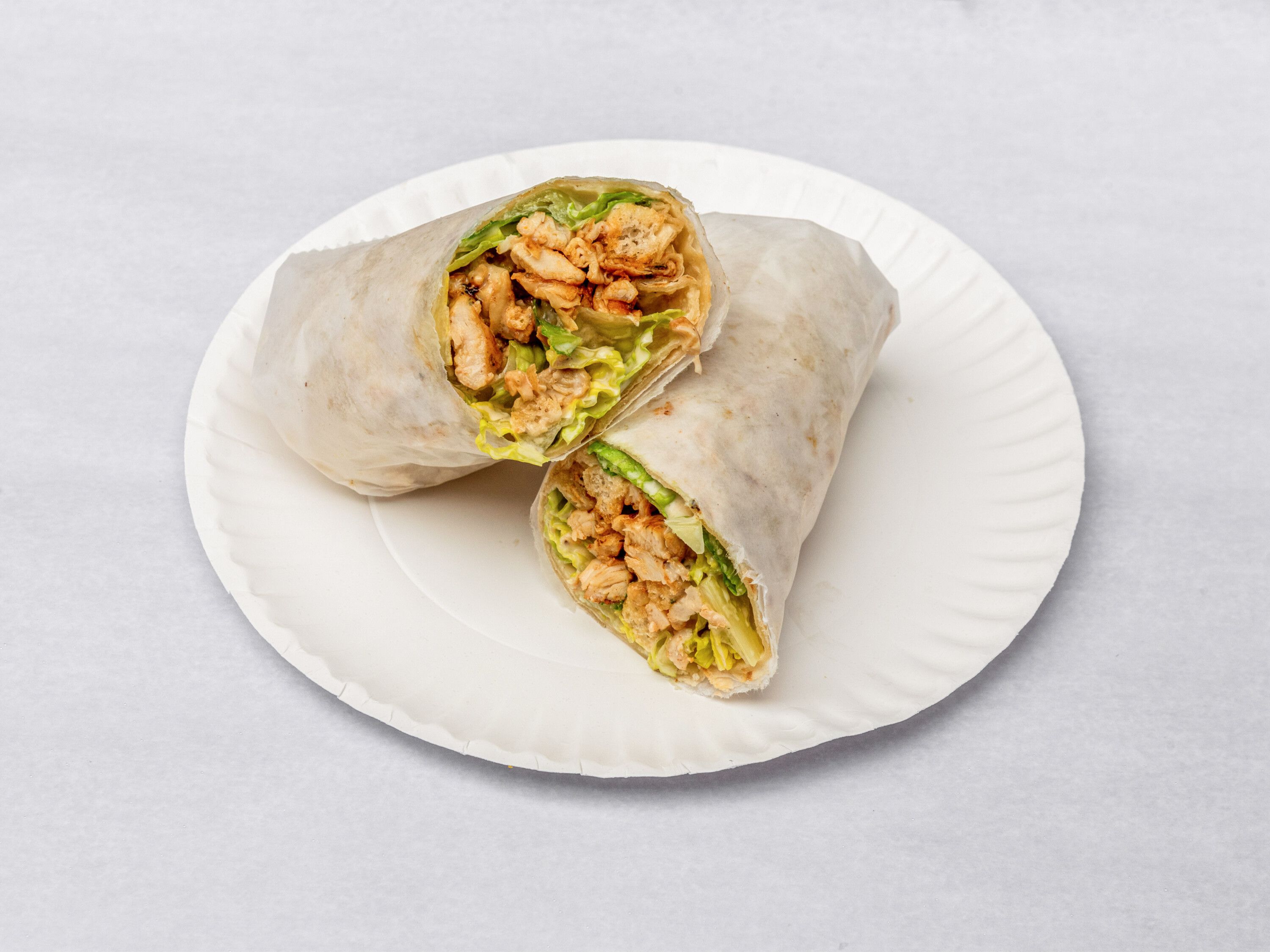 Order Grilled Chicken Caesar Wrap food online from Arboretum Pizza Grill store, Roslindale on bringmethat.com