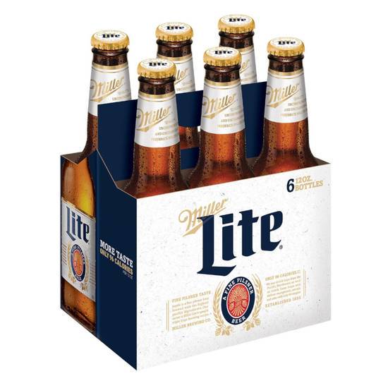 Order Miller Lite 6 cans | 4% abv food online from Pink Dot Logan Heights store, San Diego on bringmethat.com