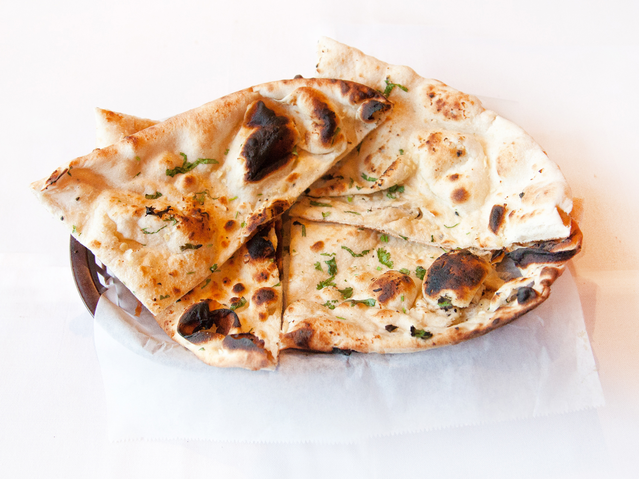 Order Garlic Basil Naan food online from India's Grill store, Los Angeles on bringmethat.com