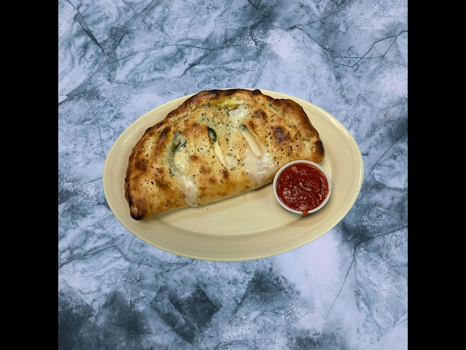 Order Spinach Calzone* food online from The Slice Pizzeria store, San Antonio on bringmethat.com
