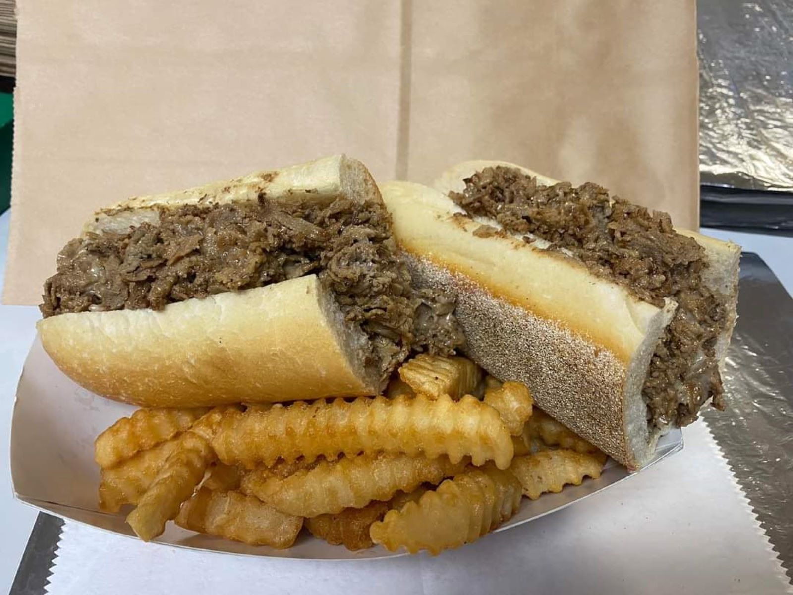 Order #2. Cheesesteak/Chicken Cheesesteak, French Fries & 16 oz. Fountain Soda food online from Italian Kitchen store, Pennsville on bringmethat.com