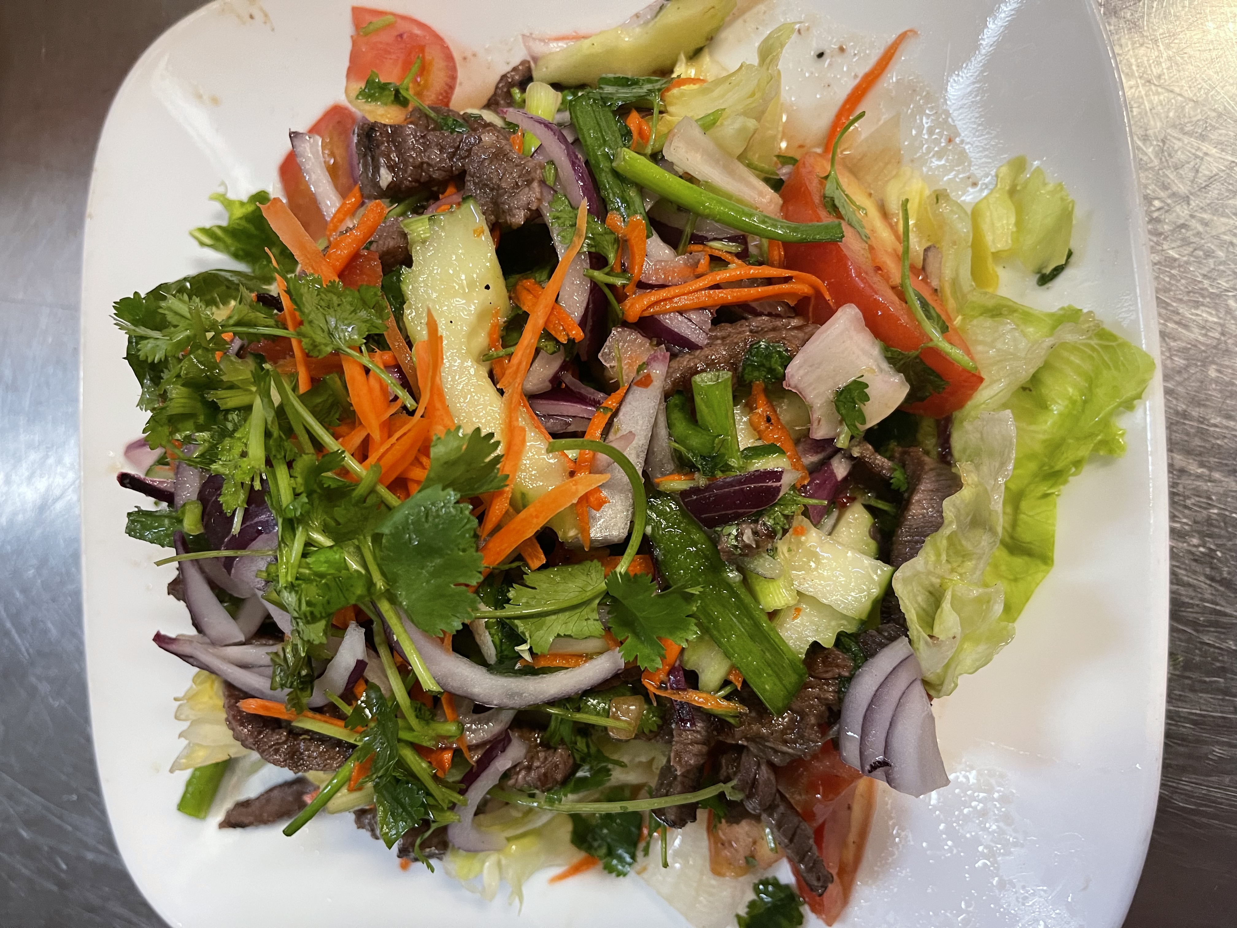 Order 26. Spicy Beef Salad food online from Chada Thai Cuisine store, Sacramento on bringmethat.com
