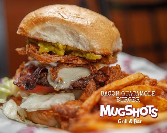 Order BACON GUACAMOLE BURGER food online from Mugshots Grill & Bar store, Starkville on bringmethat.com