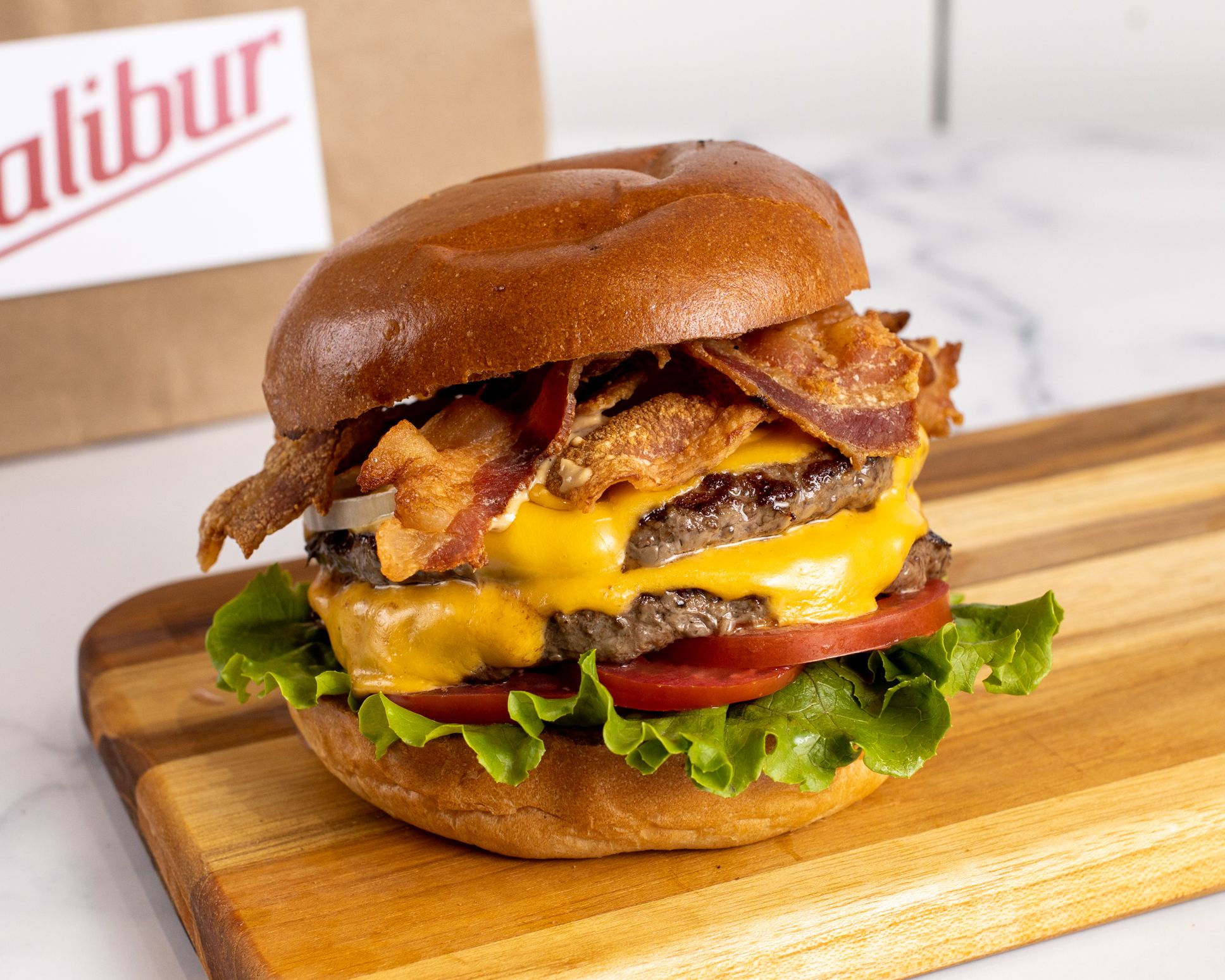 Order Double Bacon Cheeseburger food online from Calibur Express store, San Francisco on bringmethat.com