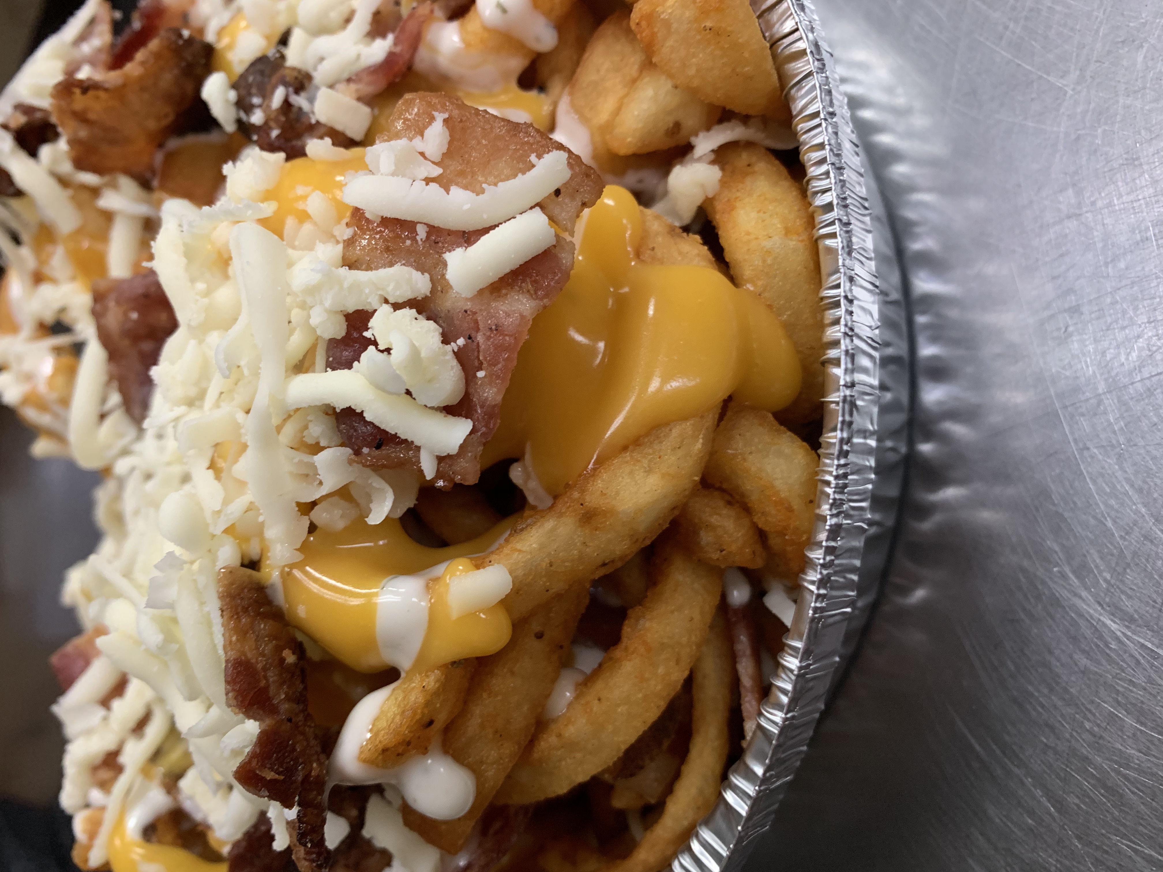 Order CURLY Loaded Fries food online from Township Line Pizza store, Drexel Hill on bringmethat.com