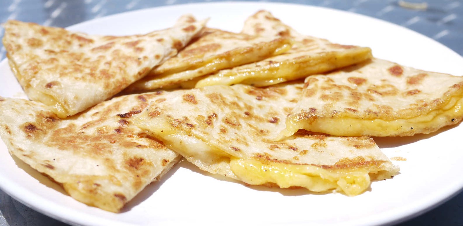 Order Large Jack and Cheddar Cheese Quesadilla food online from Tacos And Wings store, Sunland on bringmethat.com