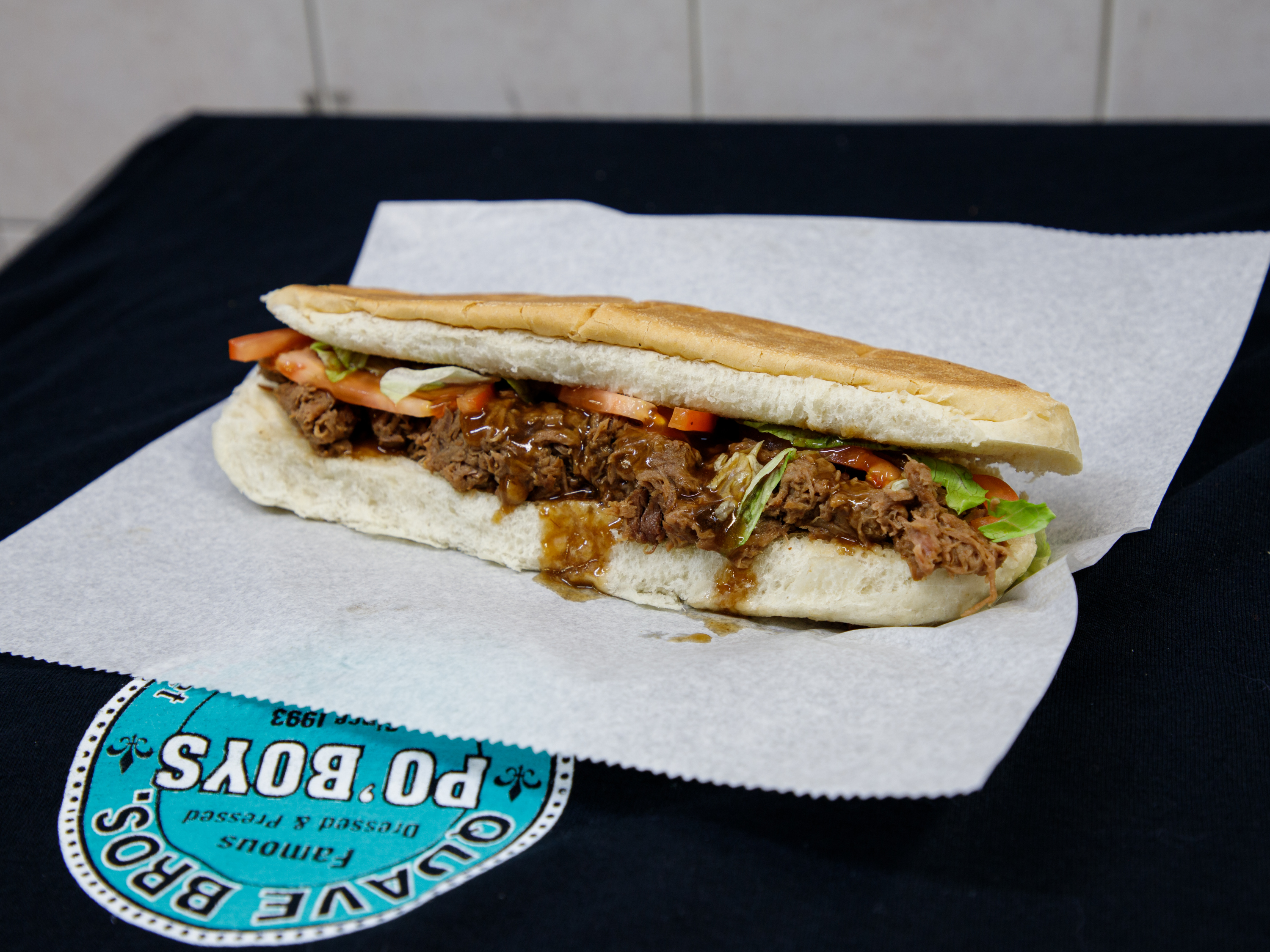 Order 16" Roast Beef NOLA Style Po'Boy food online from Quave Brothers Poboys and Meat Market store, Diberville on bringmethat.com