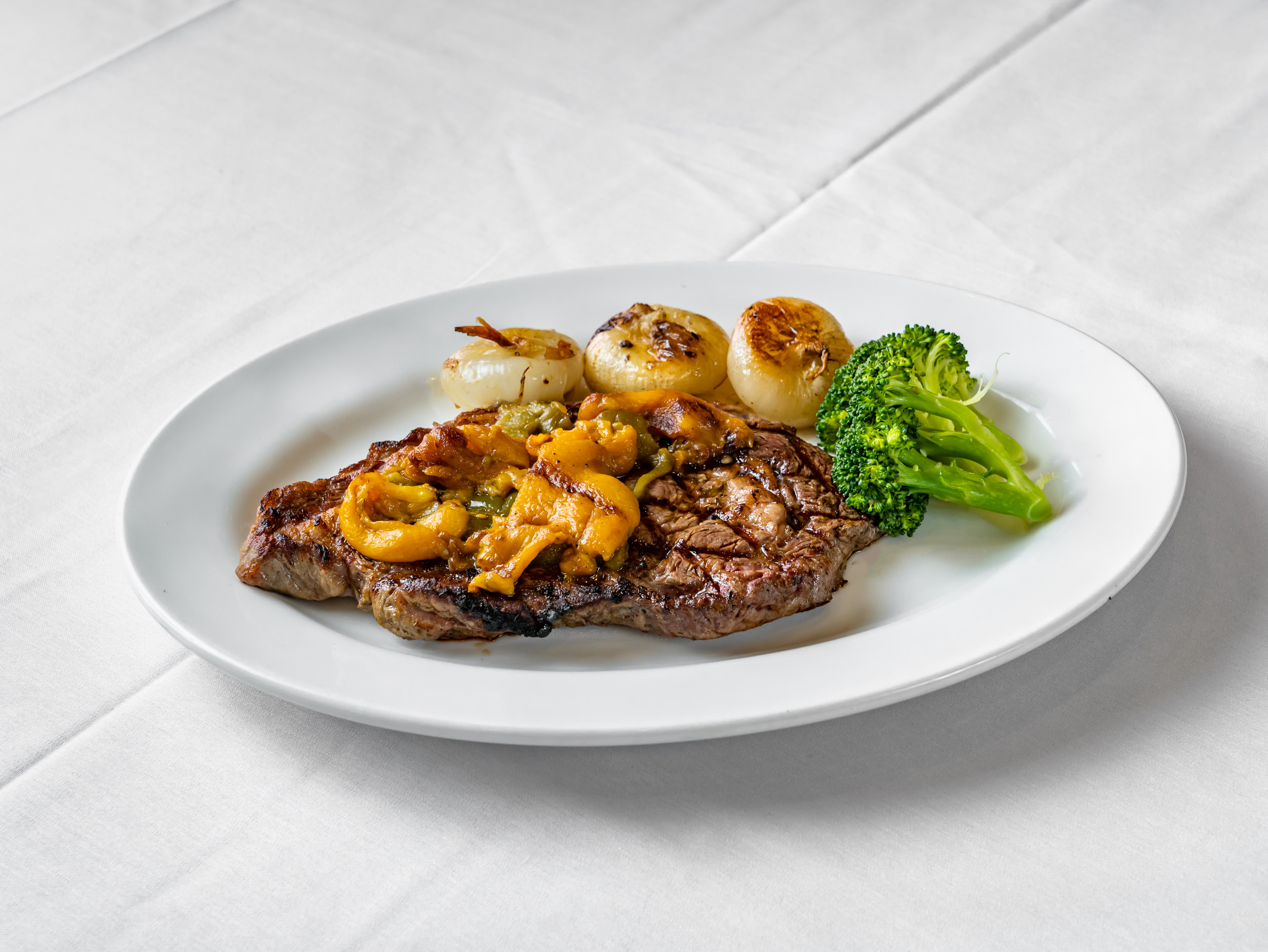 Order Grilled Rib Eye Steak food online from Portofino Ristorante store, Forest Hills on bringmethat.com