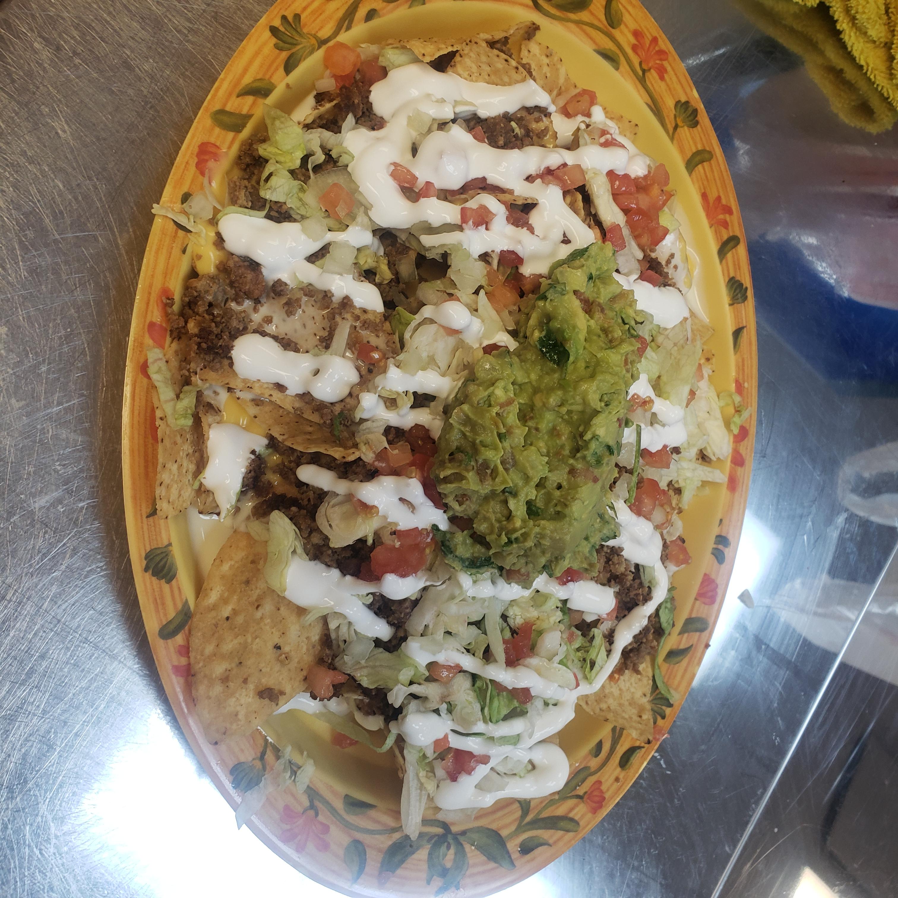 Order Loaded Nachos food online from Tony Tacos Downtown store, Bloomington on bringmethat.com