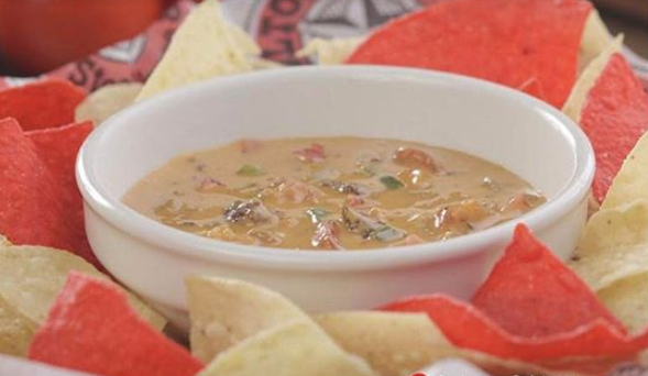 Order Queso Dip food online from Colton's Steakhouse store, Jefferson City on bringmethat.com