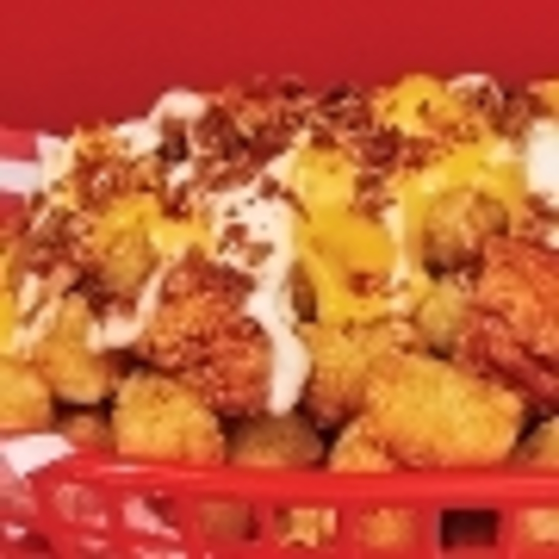 Order Cheesy Chicken Loaded Nachos: Tots food online from Wings Over Ithaca store, Ithaca on bringmethat.com