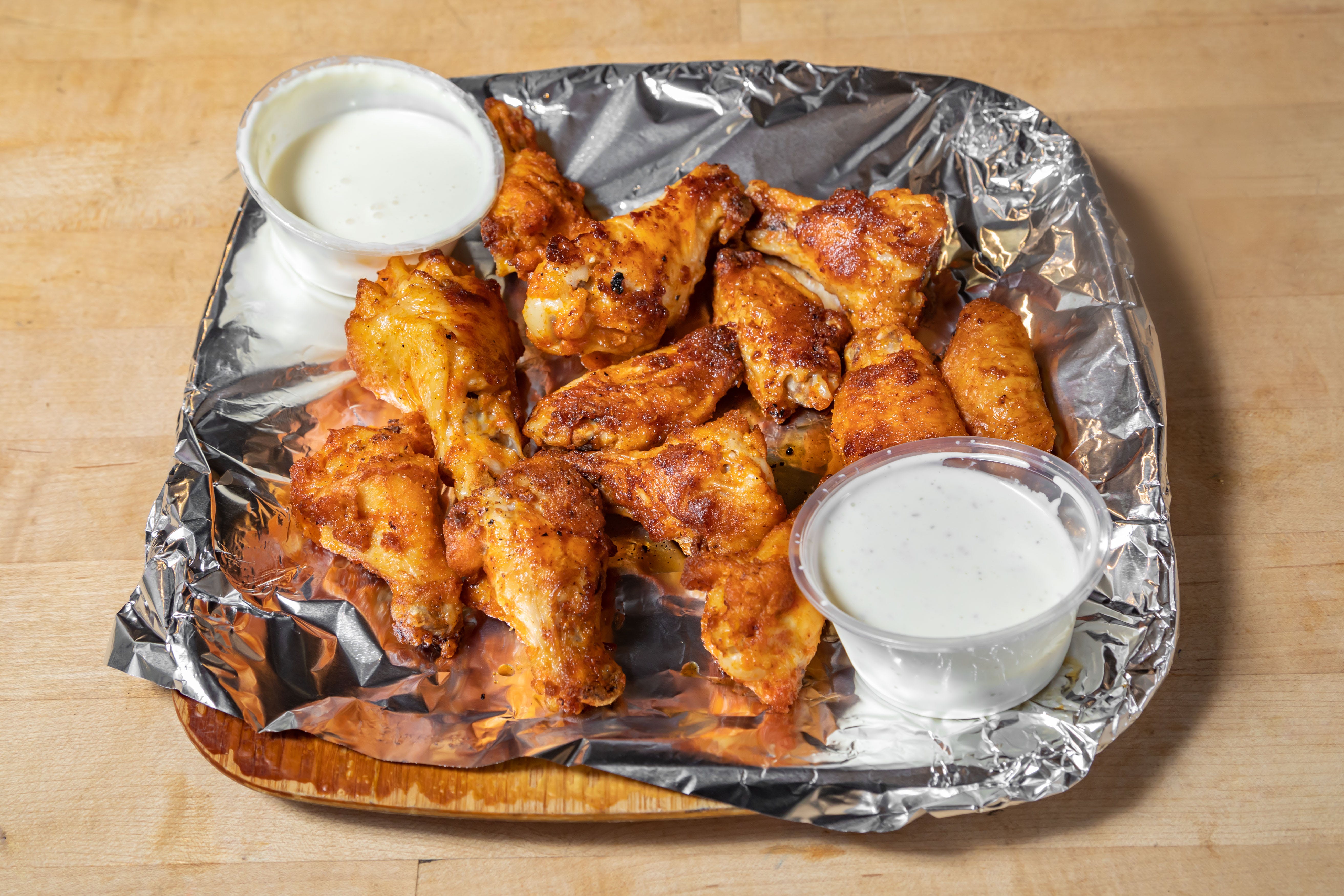 Order Buffalo Wings - 12 Pieces food online from Firehouse Pizzeria store, San Francisco on bringmethat.com