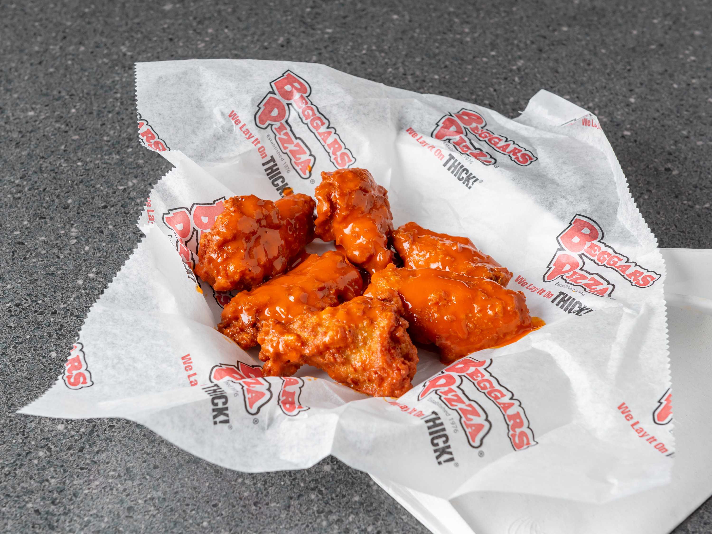 Order Boneless Wings food online from Beggars Pizza store, Orland Park on bringmethat.com