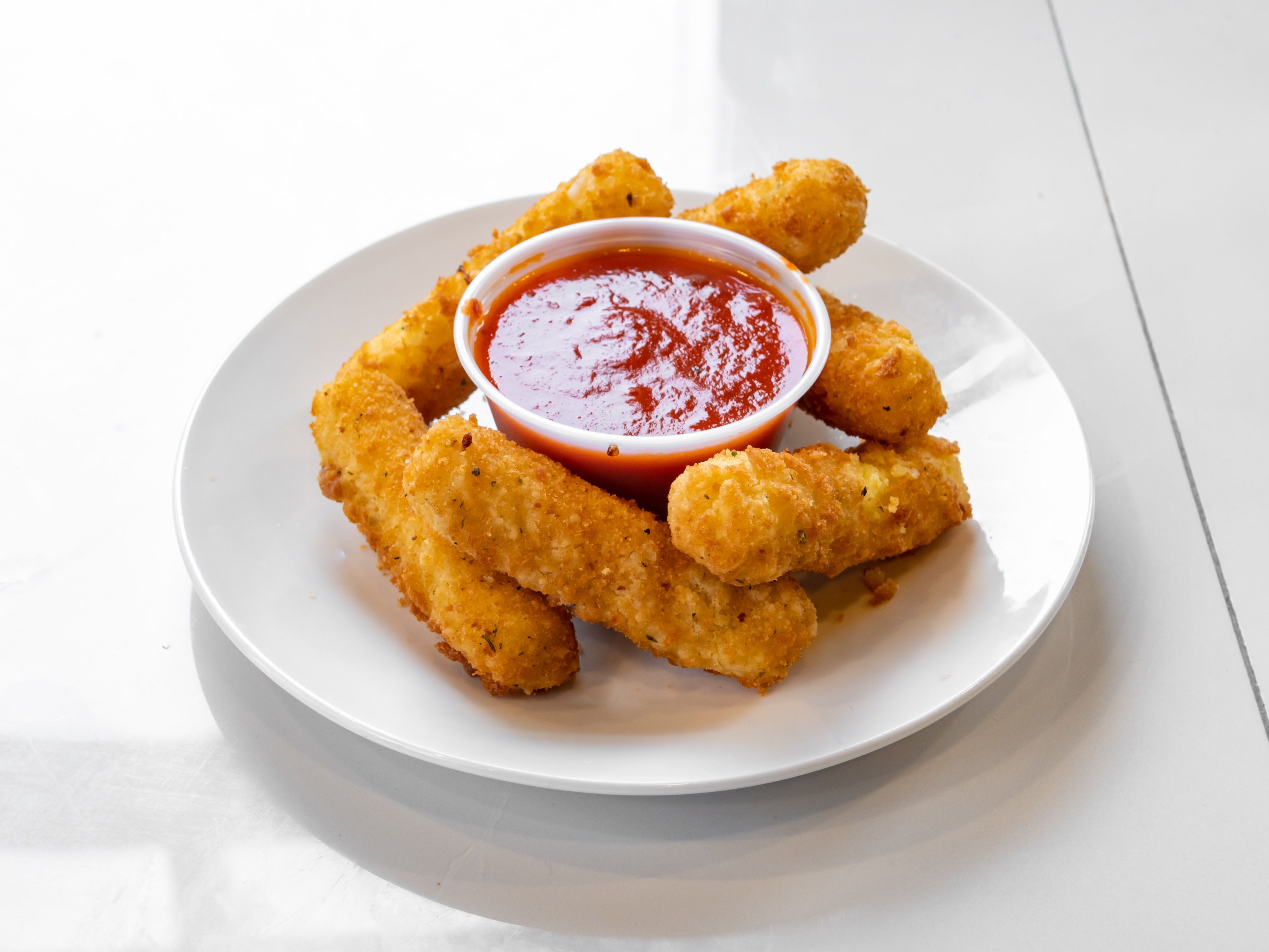 Order 6 Piece Mozzarella Sticks food online from New Yorker Pizza store, Leesburg on bringmethat.com