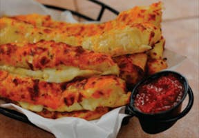 Order Cheesy Breadsticks - Regular food online from Garlic Jim's Pizza Hausman Rd store, San Antonio on bringmethat.com