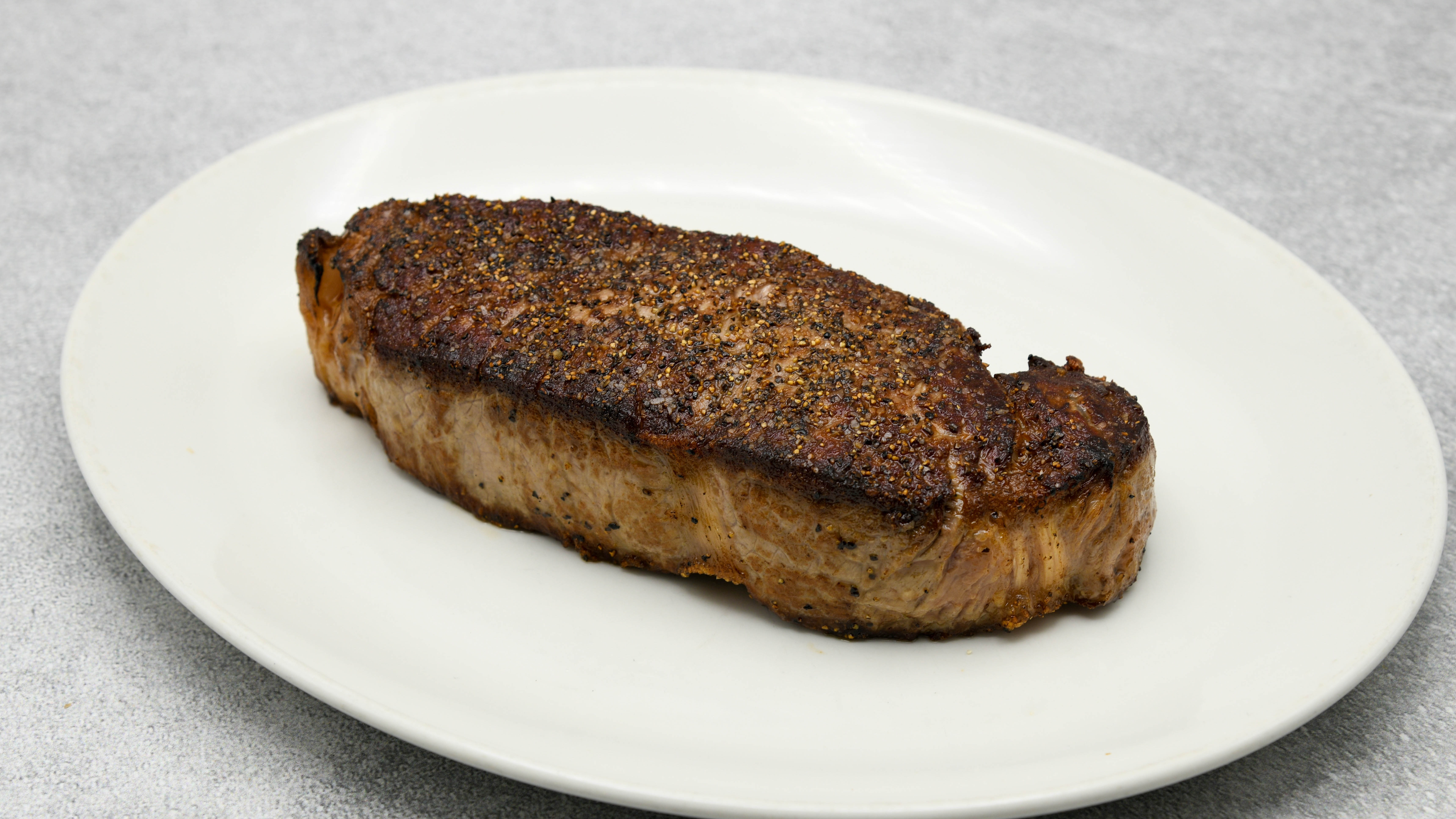 Order Prime NY Strip 16 oz food online from Del Frisco's store, Houston on bringmethat.com