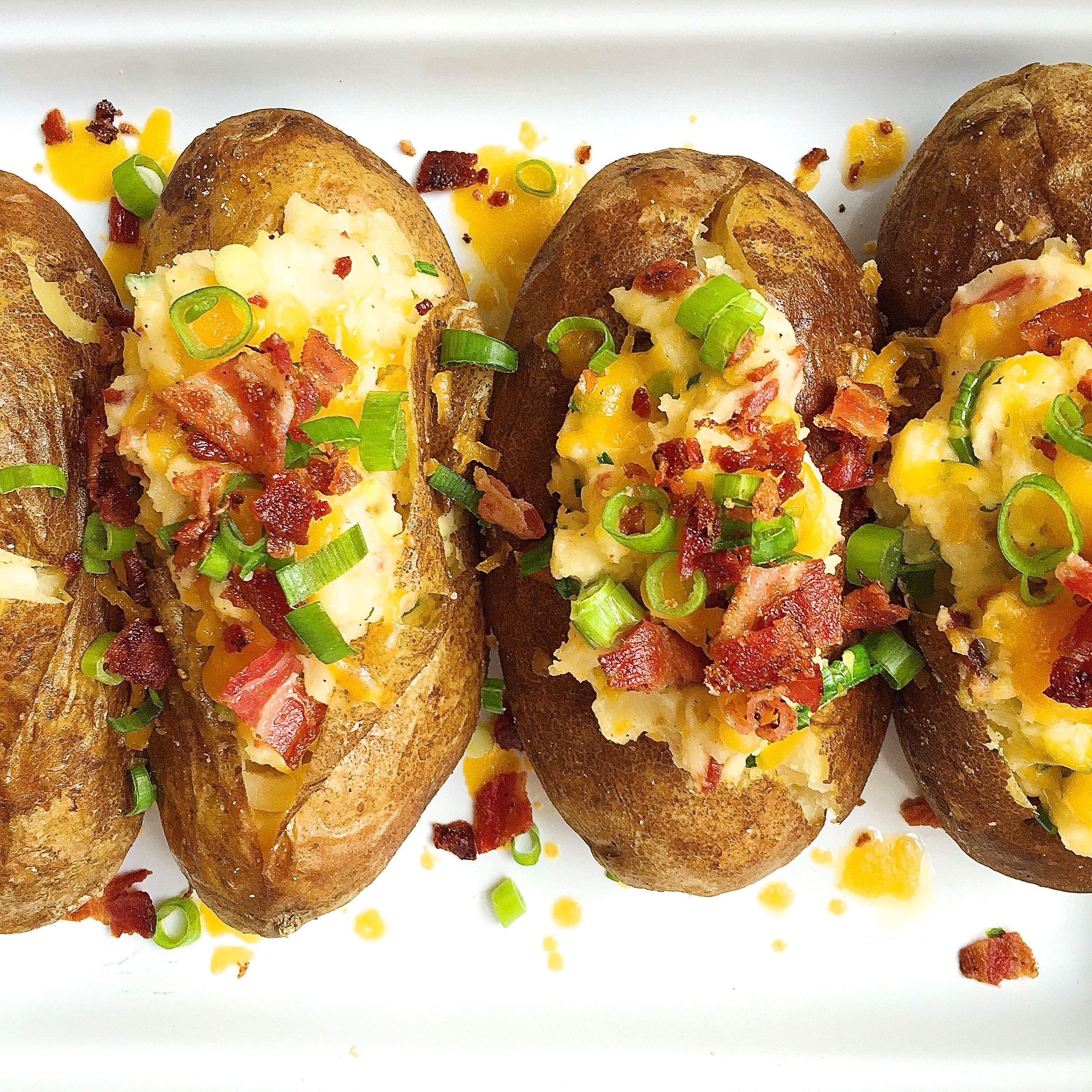 Order Stuffed Baked Potatoes with Bacon and Cheddar Cheese food online from Jackson Hole store, Englewood on bringmethat.com