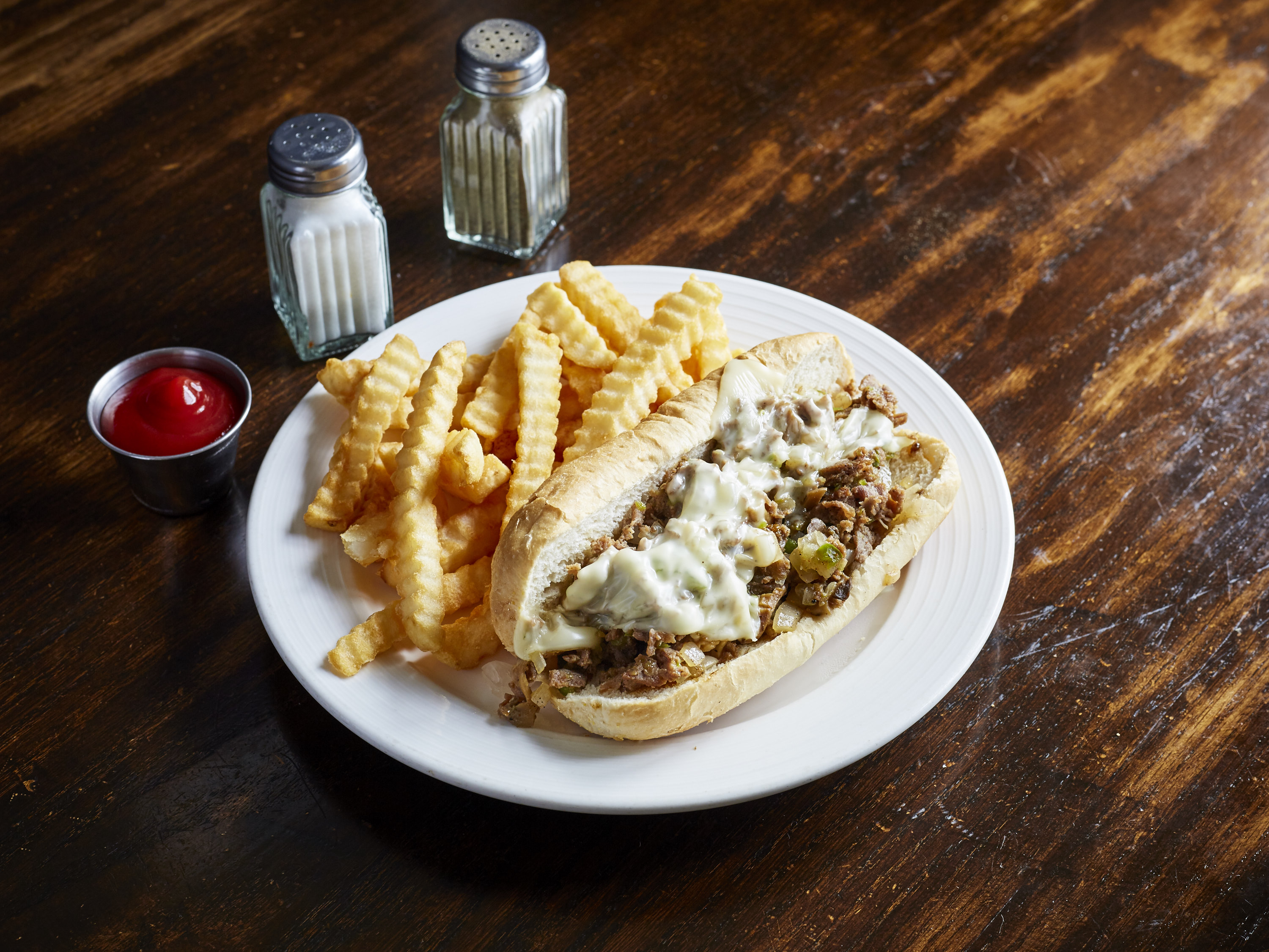 Order Philly Cheese Steak Sub with Fries food online from Dukes Wings And Seafood store, Plainville on bringmethat.com