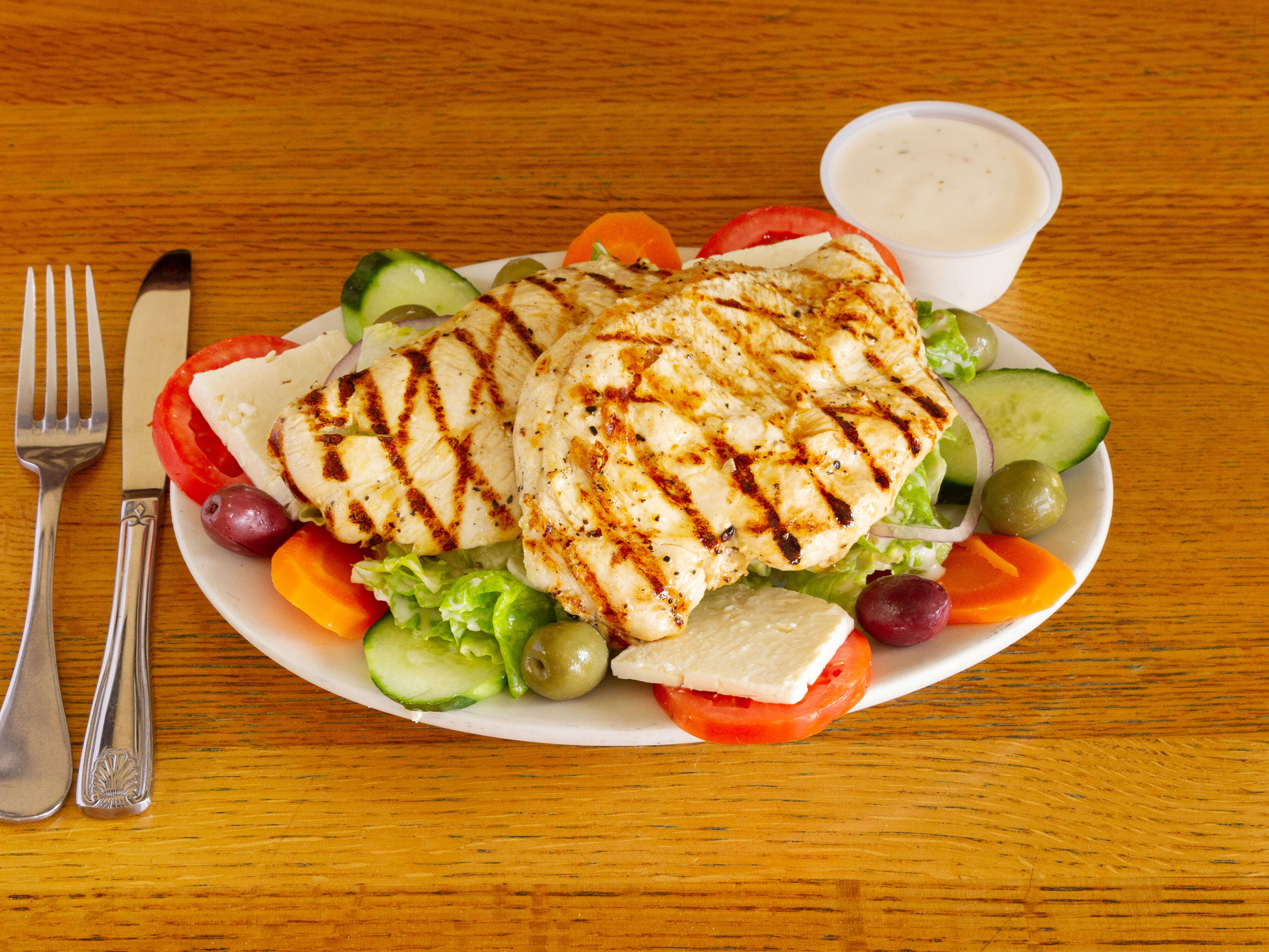 Order Greek Salad with Grilled Chicken food online from Dino's store, Boston on bringmethat.com