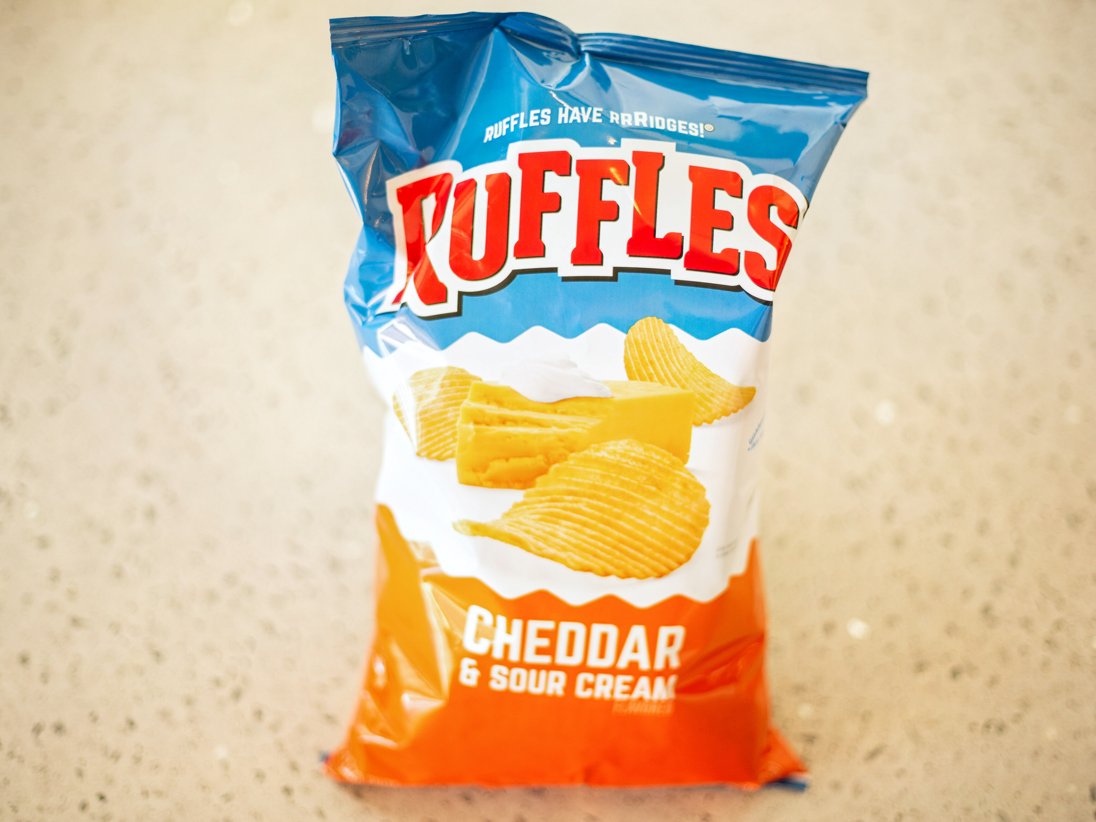 Order Ruffles Cheddar & Sour Cream food online from Convenient Food Mart store, Chicago on bringmethat.com