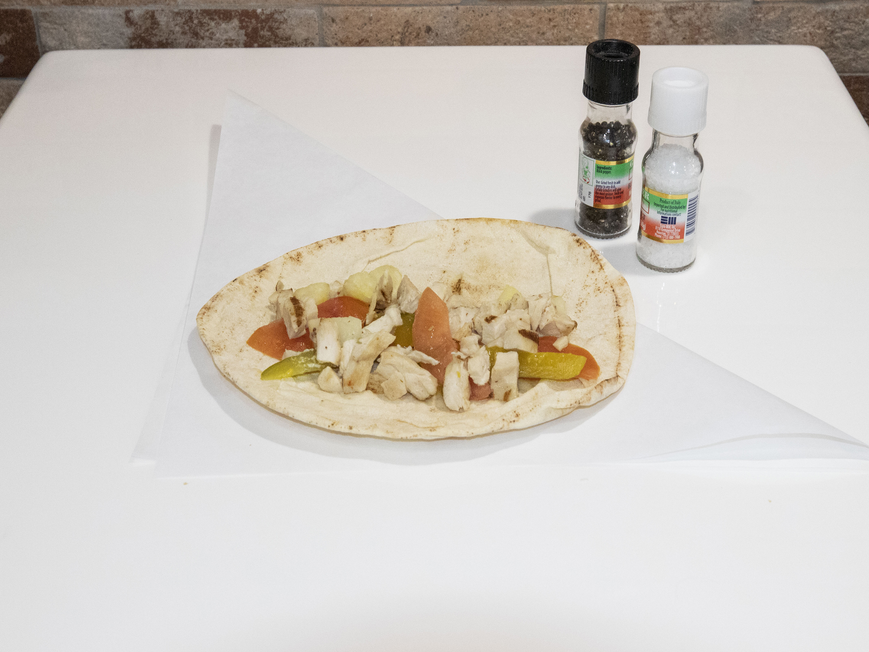 Order GRILLED CHICKEN WRAP food online from Paulies Poboys store, Houston on bringmethat.com