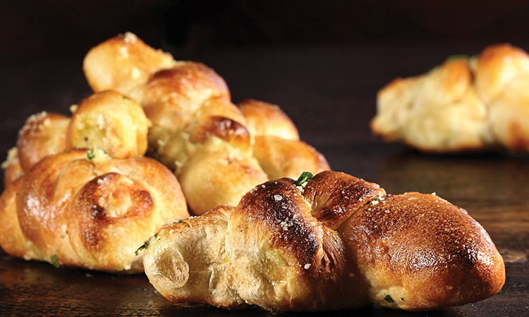 Order Truffle Garlic Knots* food online from New York Pizzeria store, Pearland on bringmethat.com