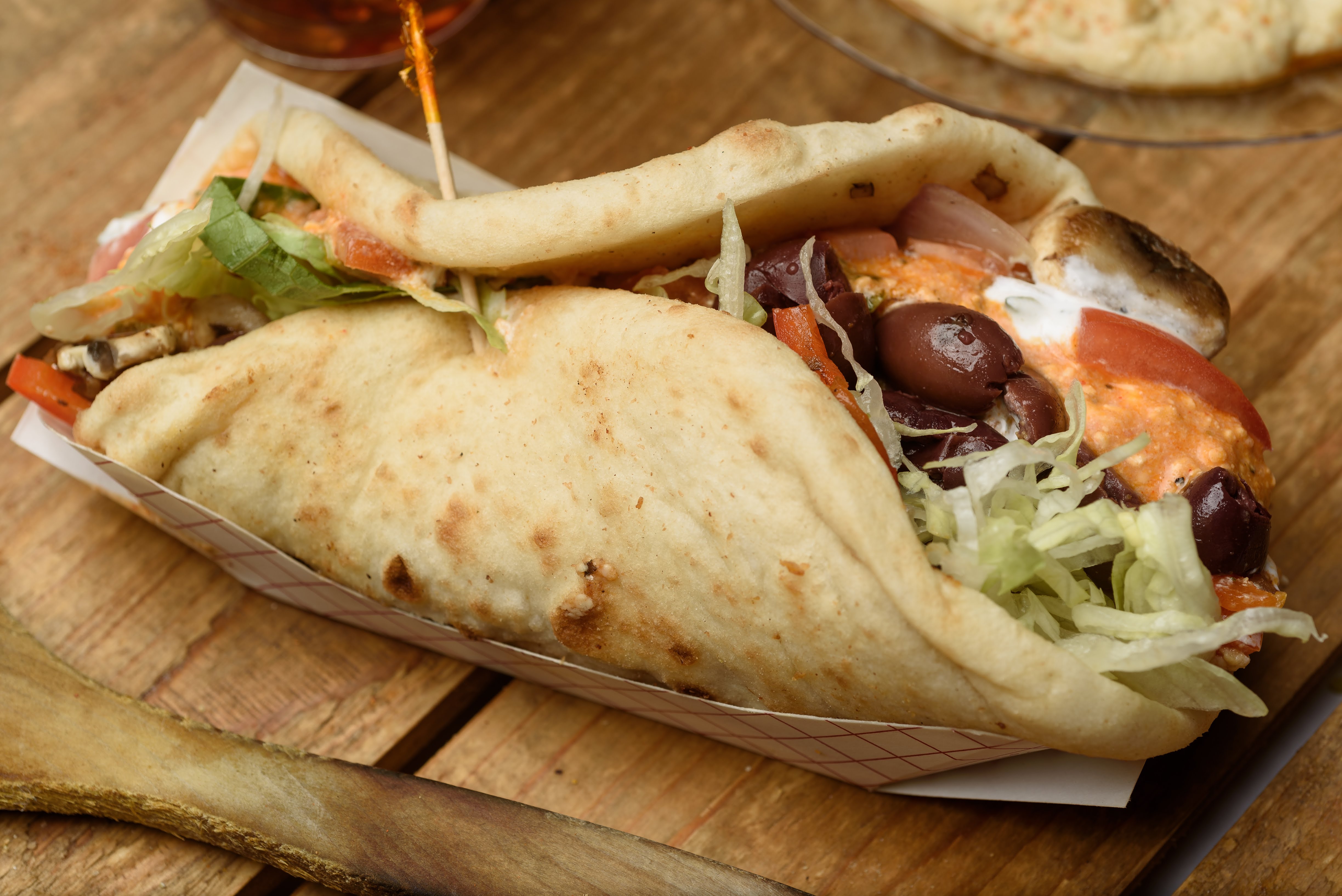 Order Veggie Pita Wrap food online from Zorbas store, Youngsville on bringmethat.com