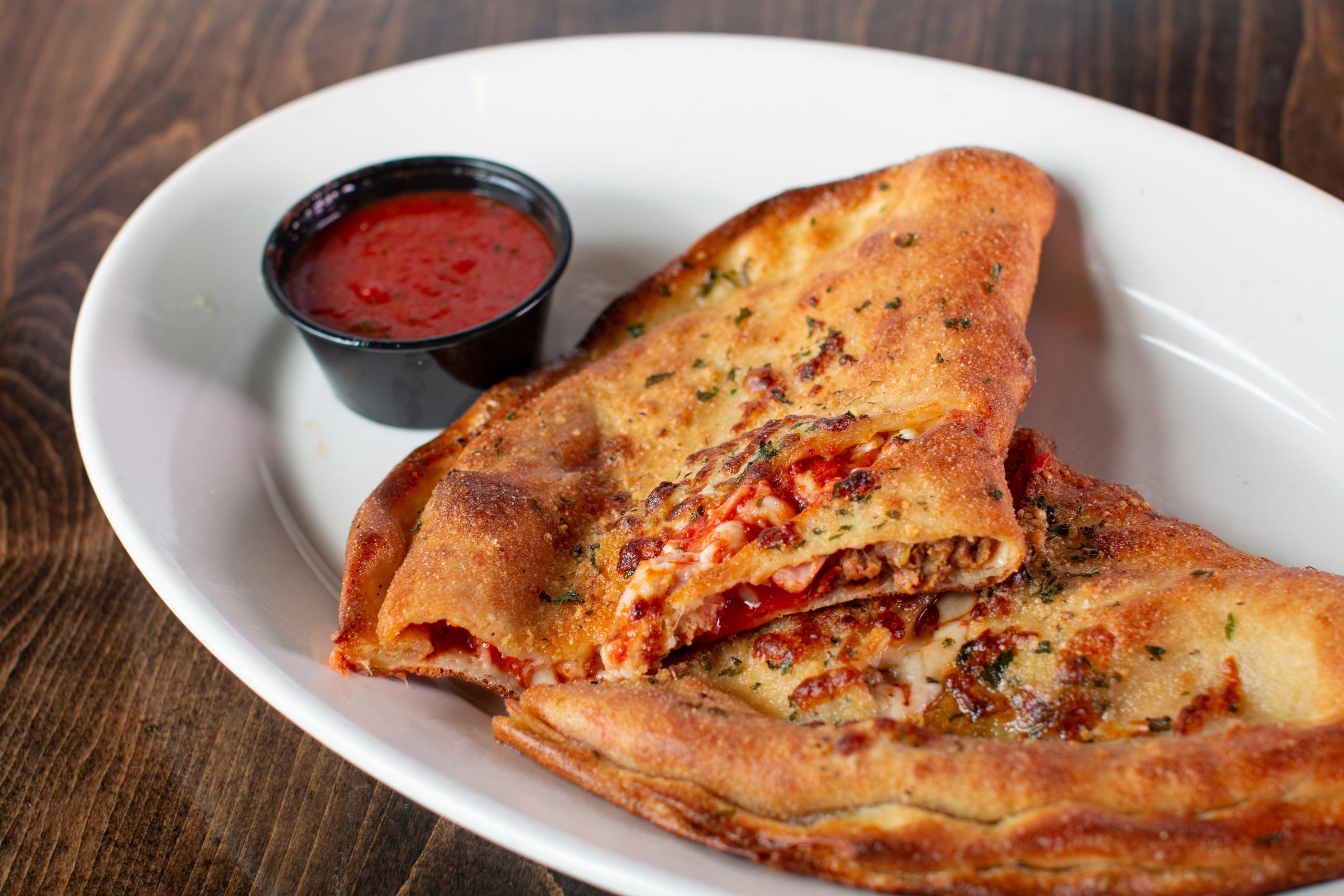 Order Four Meat Calzone food online from Benvenuto's italian grill store, Madison on bringmethat.com