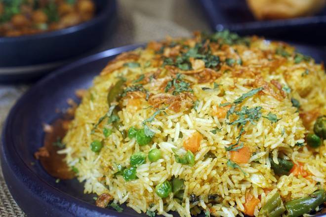 Order Veg Biryani food online from Wok Indian Kitchen store, Suwanee on bringmethat.com