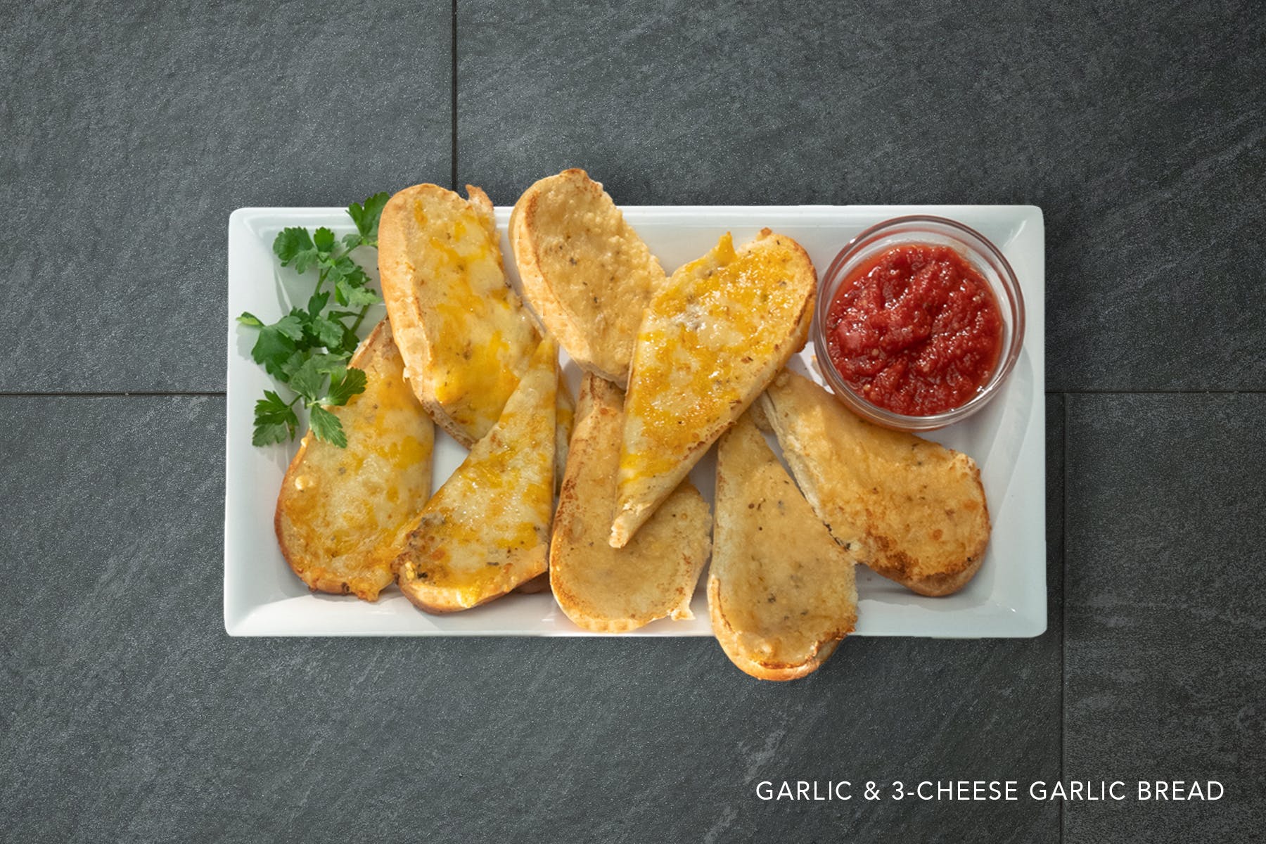 Order Three Cheese Garlic Bread - 4 Pieces food online from Zio Pizzeria - store, Omaha on bringmethat.com