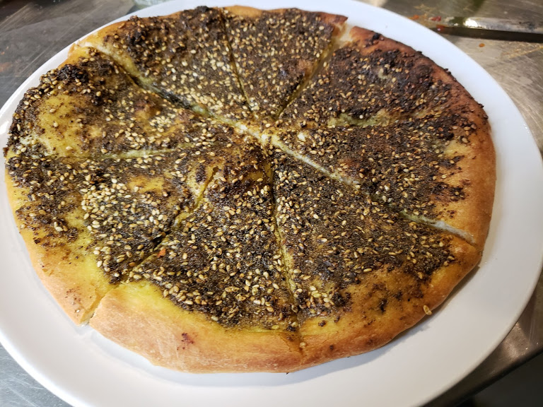 Order 9. Za'atar Mana'eesh food online from Icreate Cafe store, Pottstown on bringmethat.com