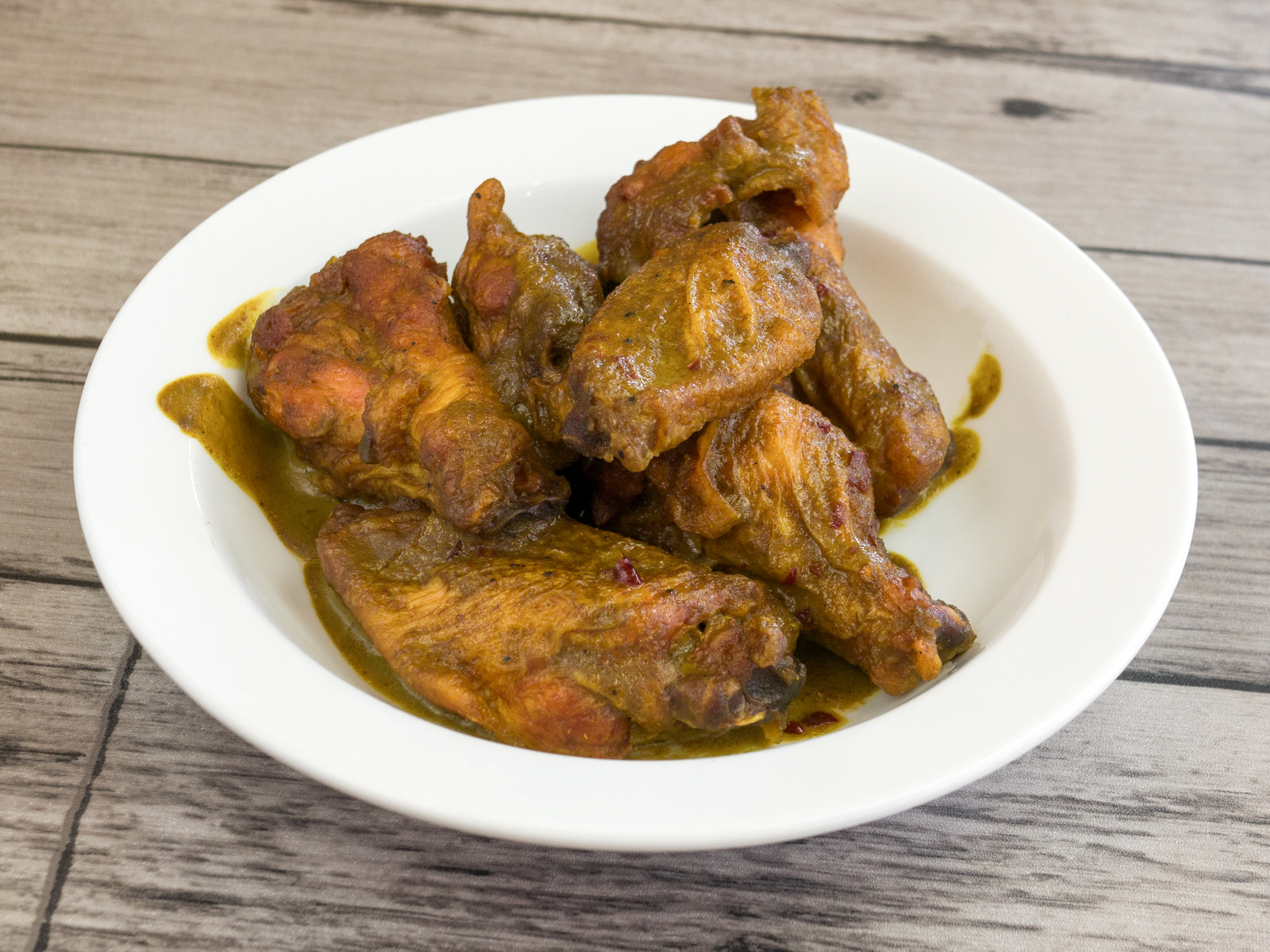 Order A10. Spicy Curry Wings food online from Crazy Wok store, Houston on bringmethat.com