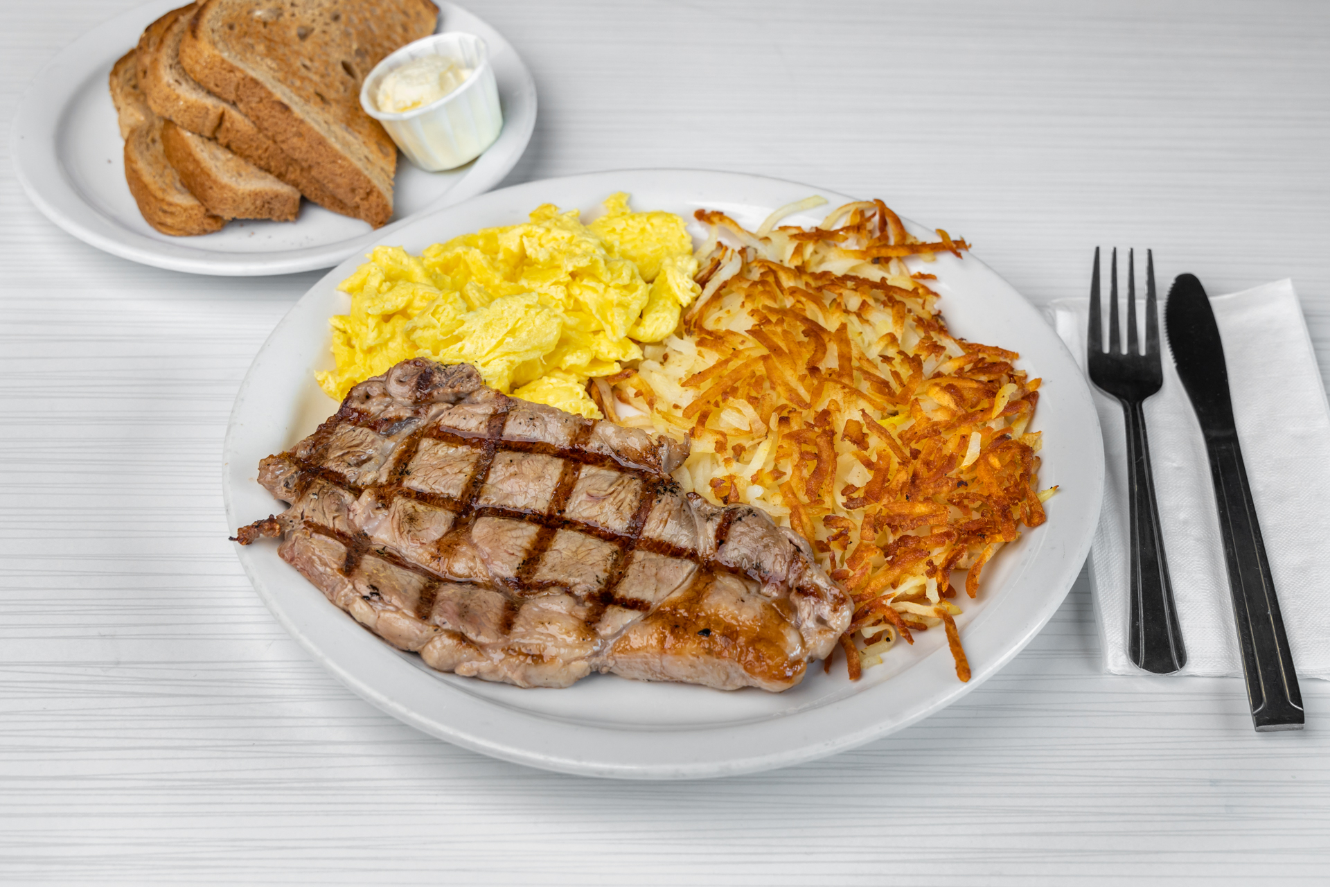 Order 12. Rib Eye Steak Breakfast food online from Goody Cafe store, Palm Desert on bringmethat.com