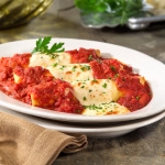 Order MANICOTTI food online from Zio's Italian Kitchen store, Oklahoma City on bringmethat.com