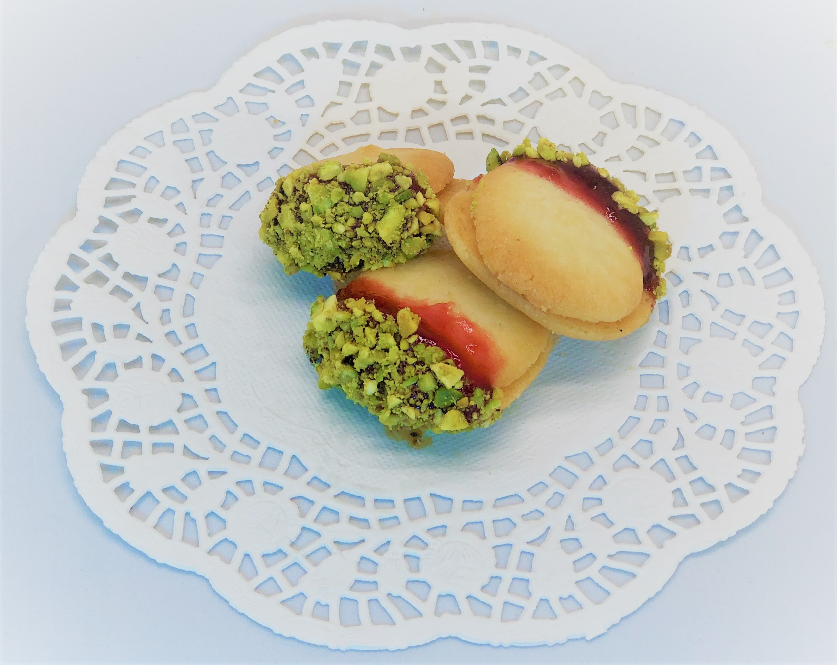 Order Raspberry Pistachio Forest (Per 1/2 lb) food online from Palace Bakery store, Laguna Hills on bringmethat.com